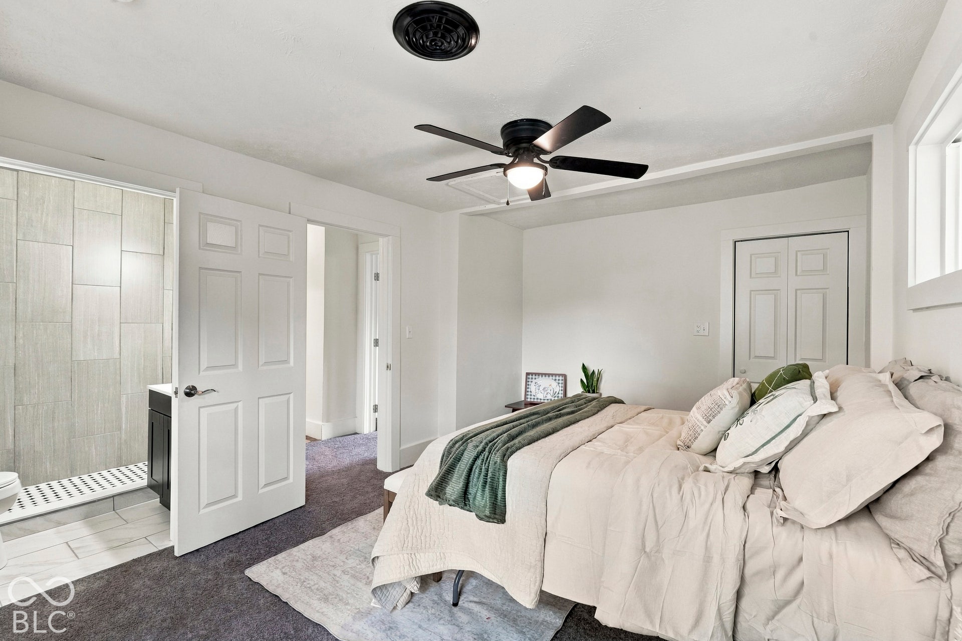 Primary bedroom (upper level) with walk-in closet and ensuite full bath (bedroom 4)