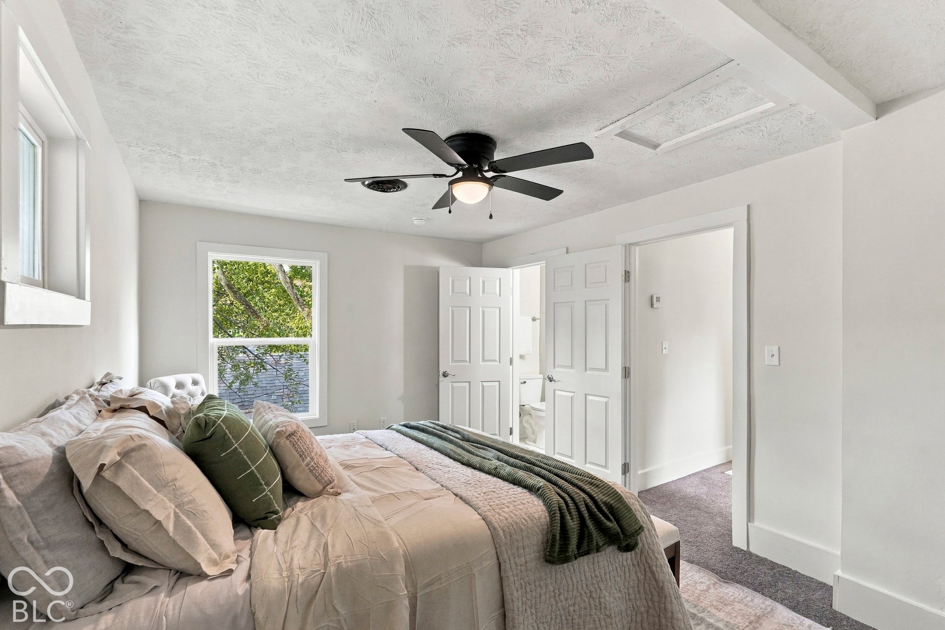 Primary bedroom (upper level) with walk-in closet and ensuite full bath (bedroom 4)