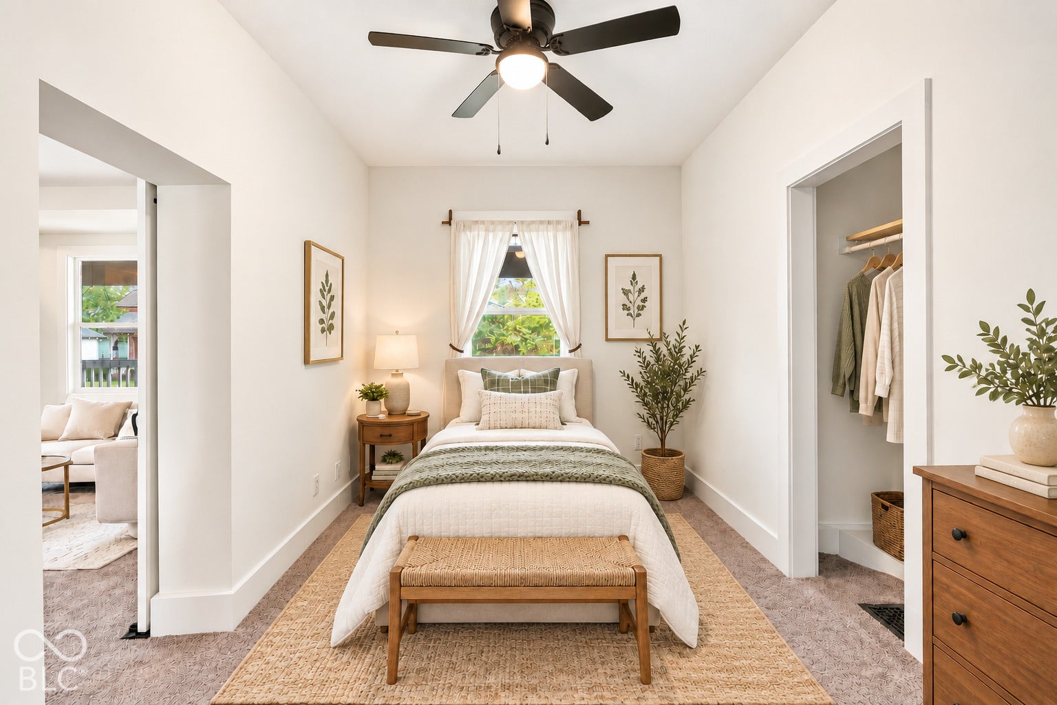 Virtually Altered - Neutral-toned interior room featuring wall-to-wall carpeting, an integrated ceiling fan with light fixture, and a built-in reach-in closet