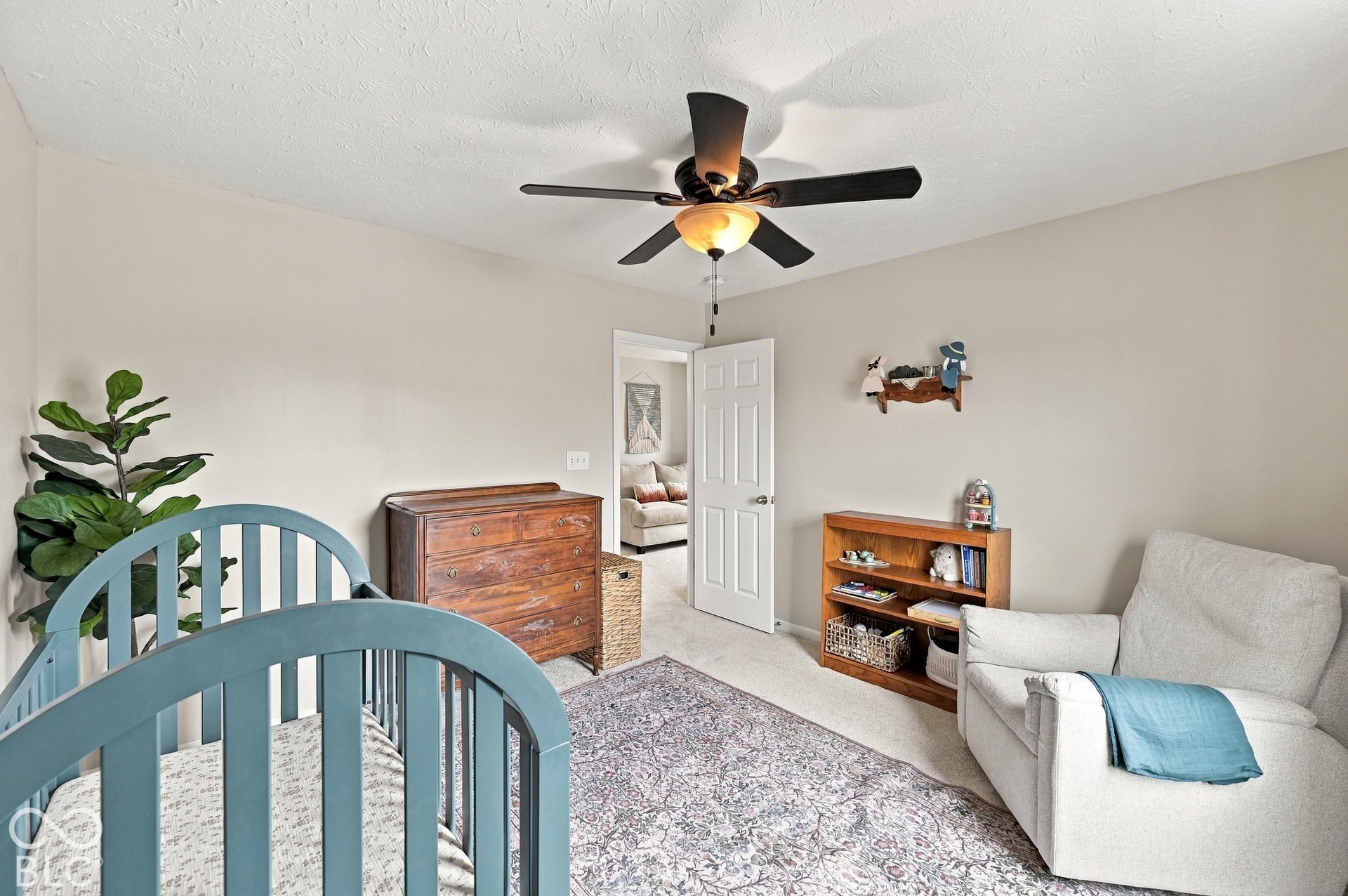 Neutral wall color palette with a ceiling fan featuring integrated lighting