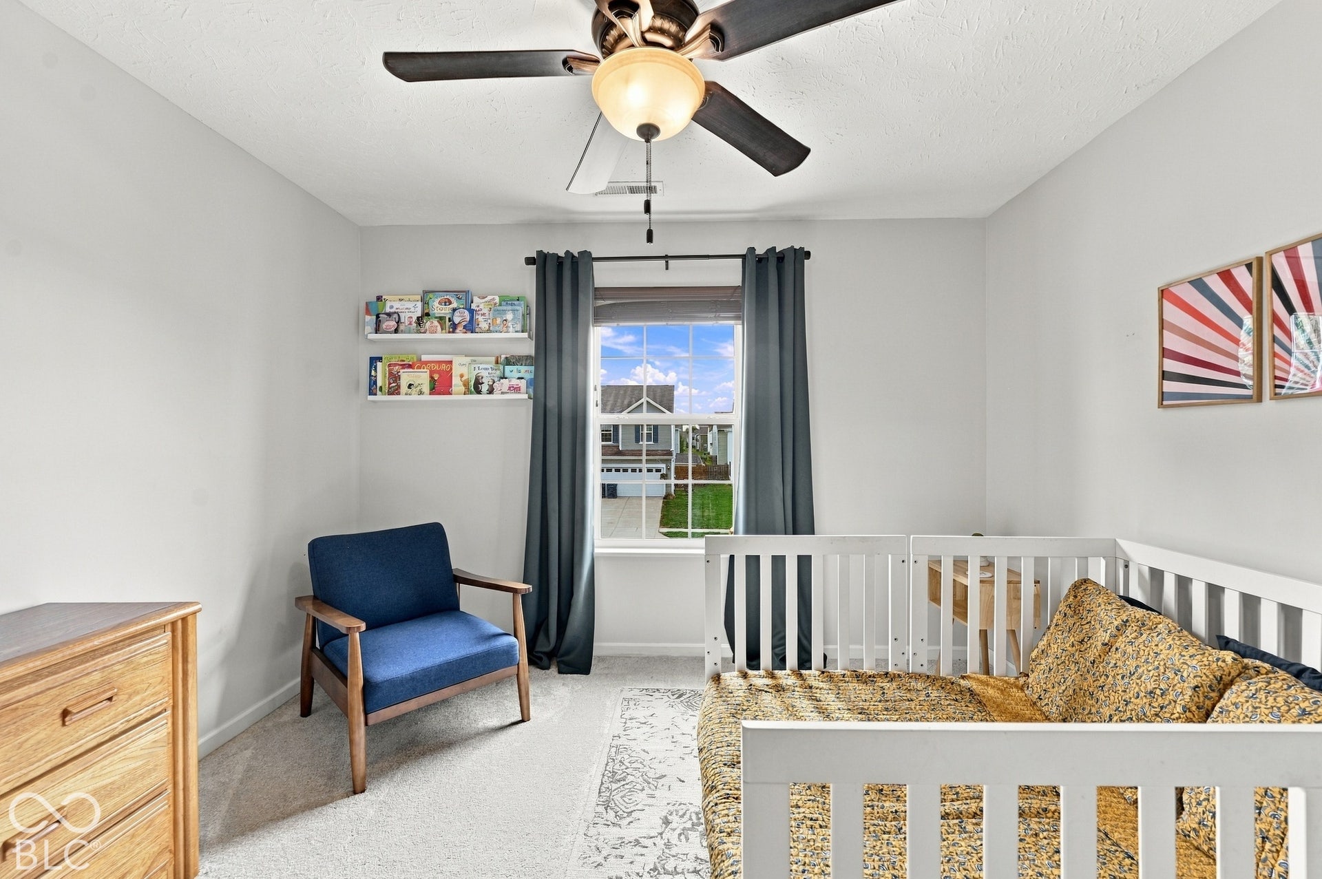 Neutral wall tones complement the window, providing natural illumination