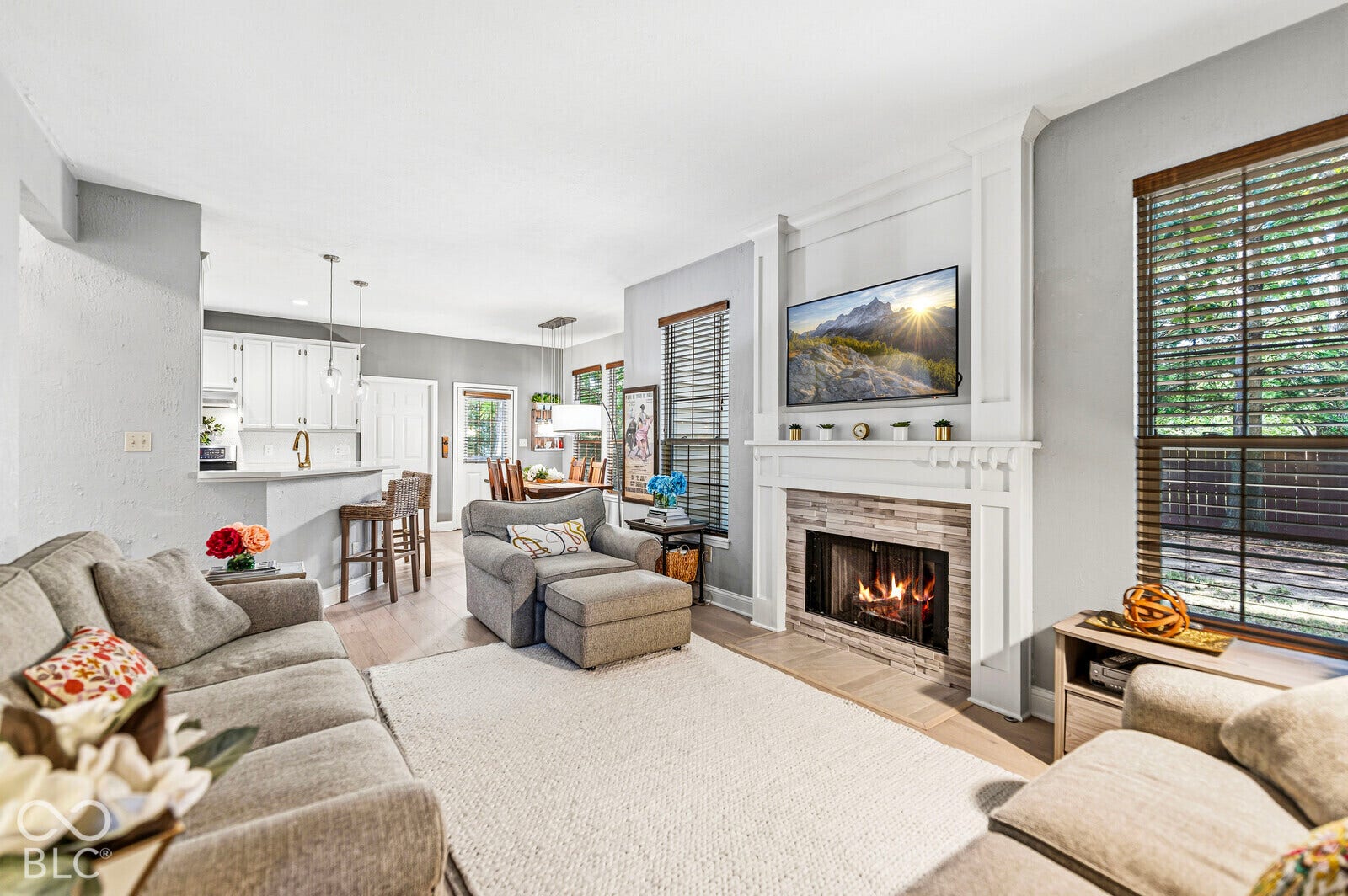 Living space featuring gas fireplace with a stone surround