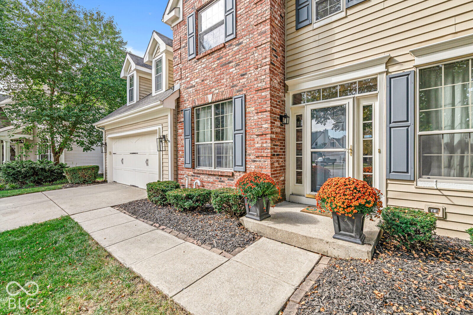 Brick and siding exterior with decorative shutters