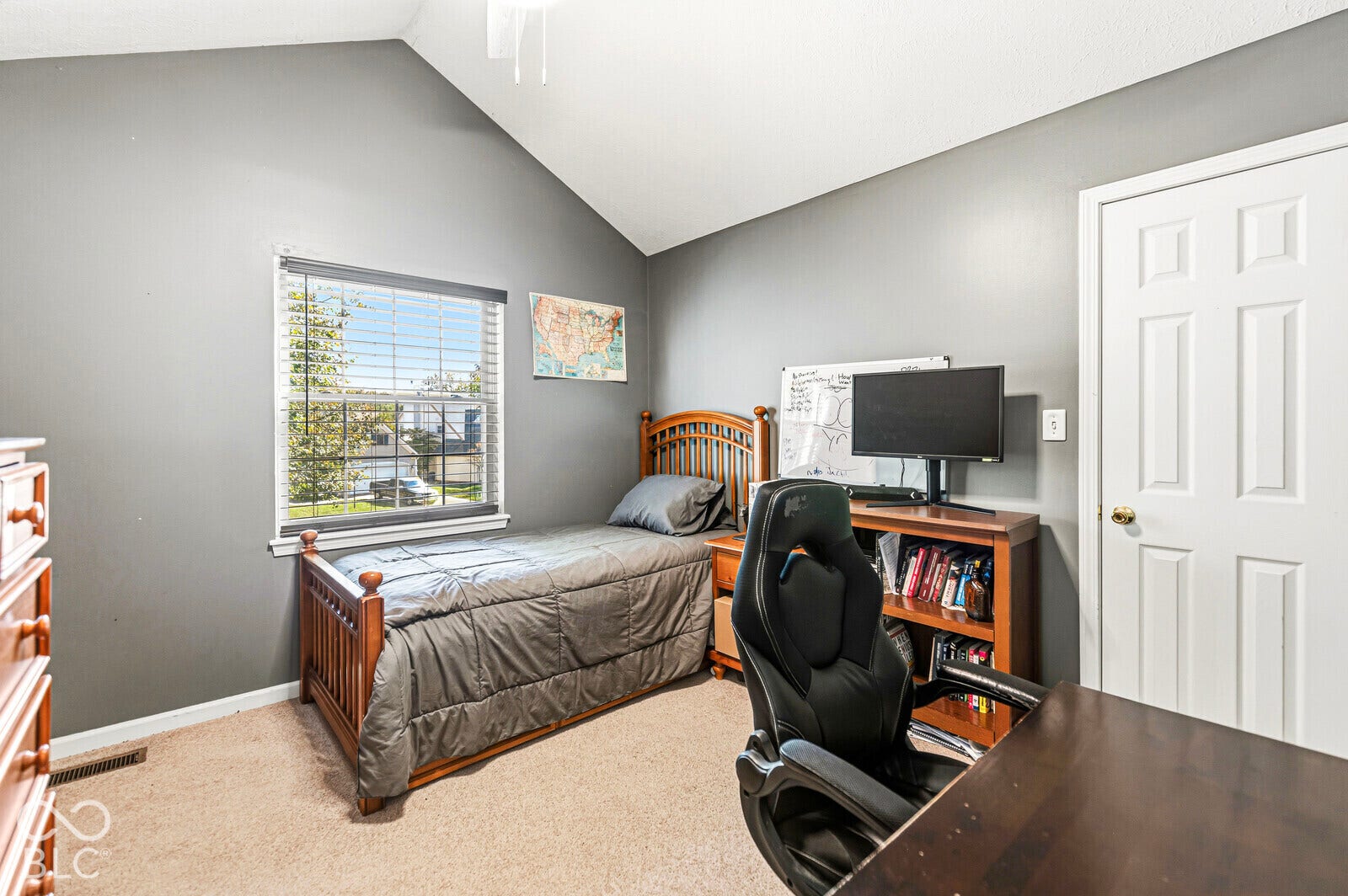 Bedroom 3 with vaulted ceiling and a ceiling fan