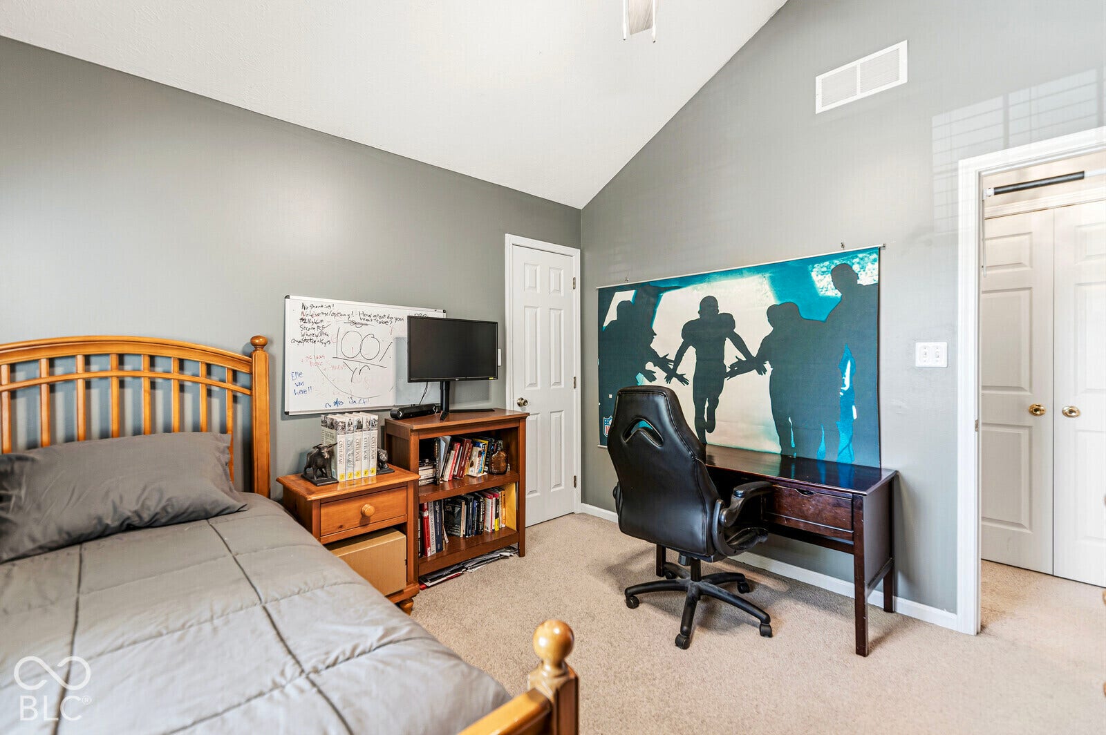 Bedroom 3 with vaulted ceiling and a ceiling fan