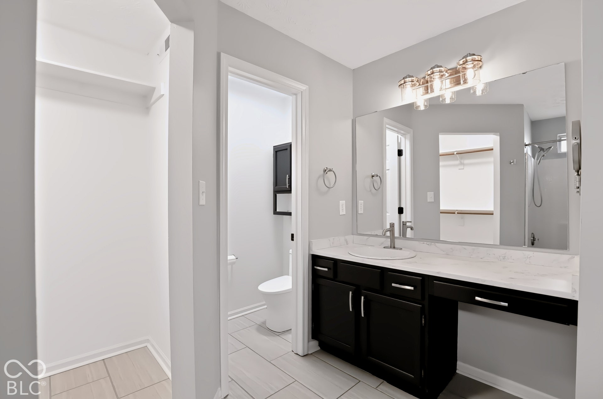 Spacious vanity with an integrated sink and extensive countertop space