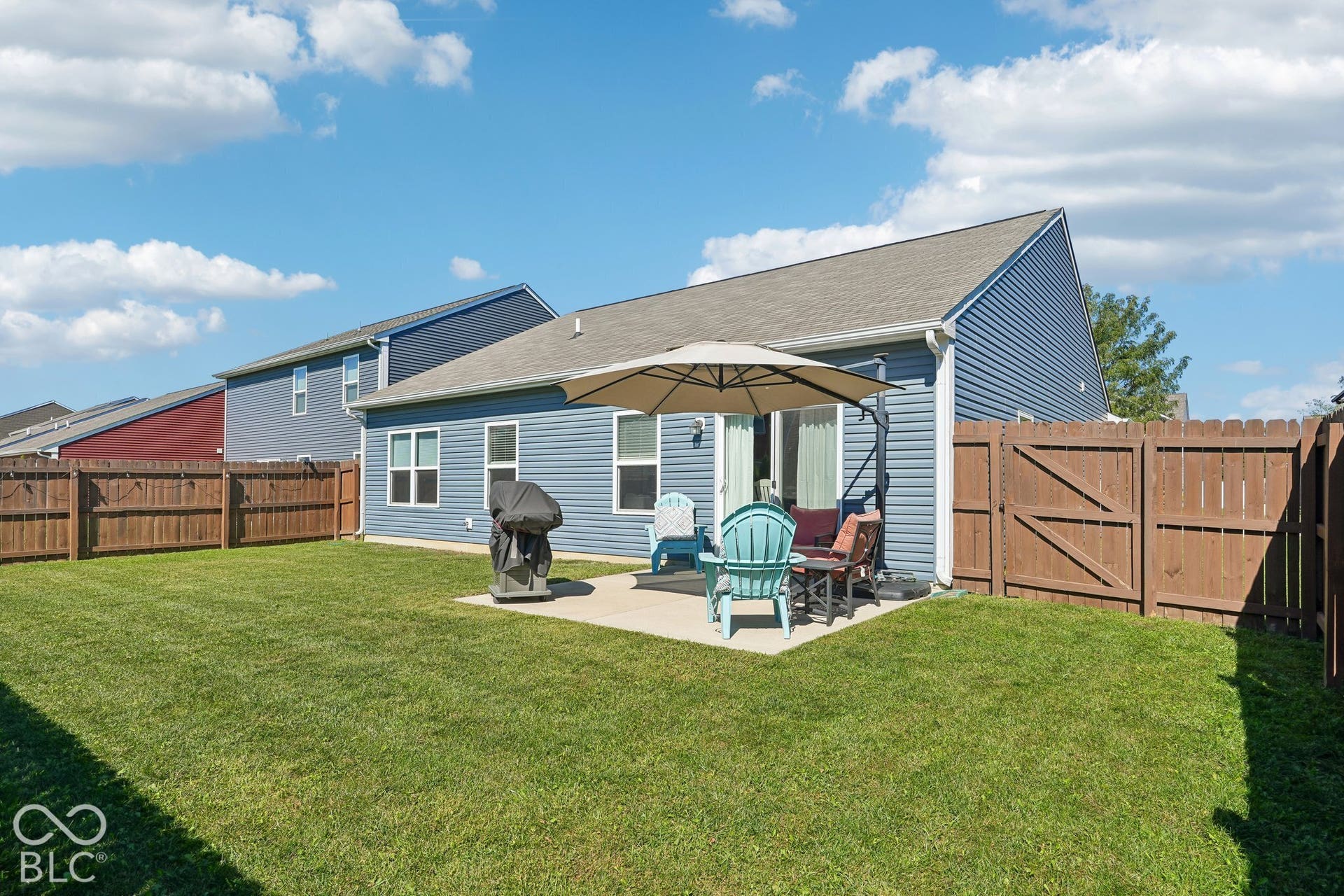 2945 W Calimanco Lane, Monrovia, IN 46157 Spacious backyard featuring a concrete patio, wood privacy fencing, and a well-maintained lawn