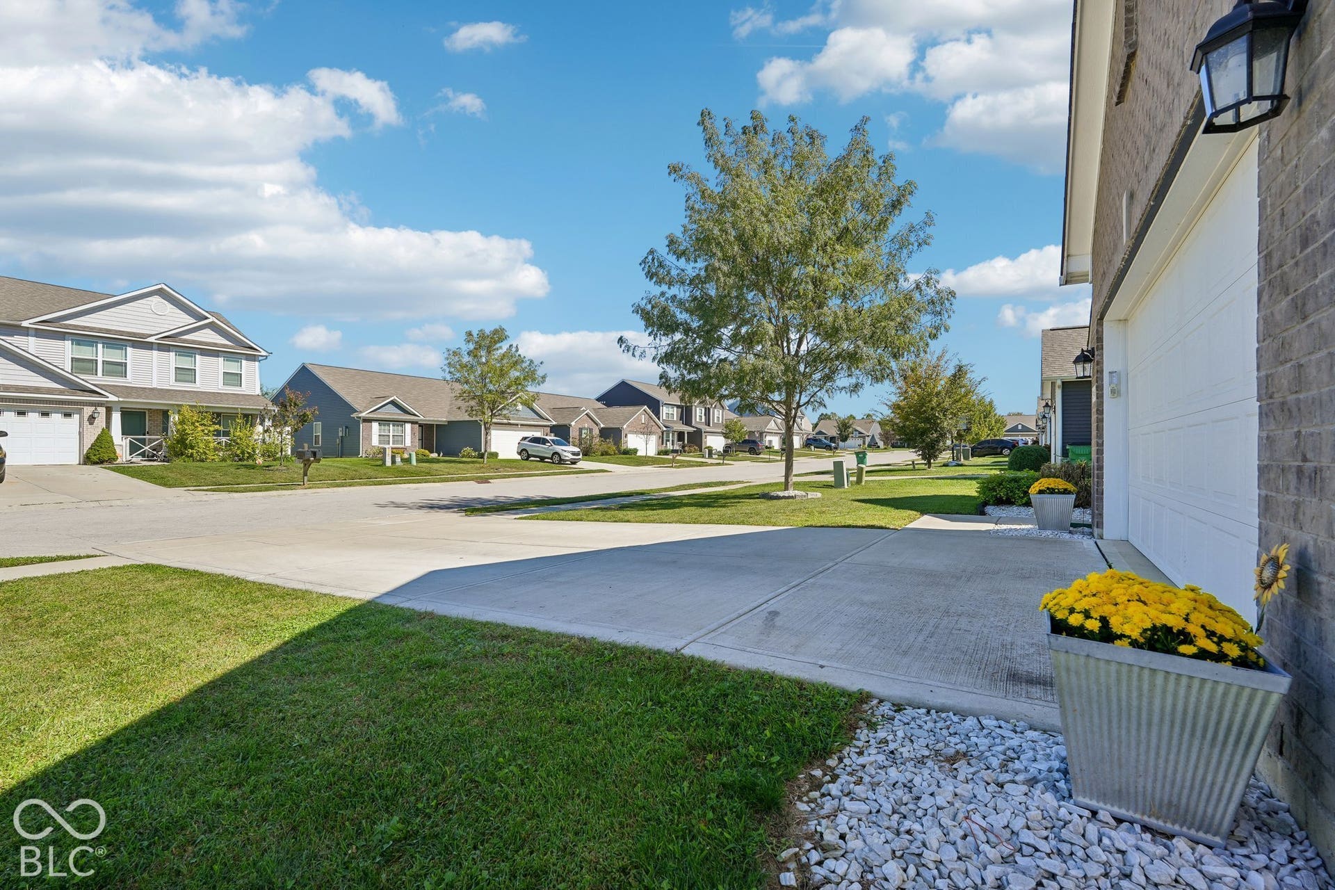 2945 W Calimanco Lane, Monrovia, IN 46157 Exterior featuring a brick facade, white garage door, and concrete driveway