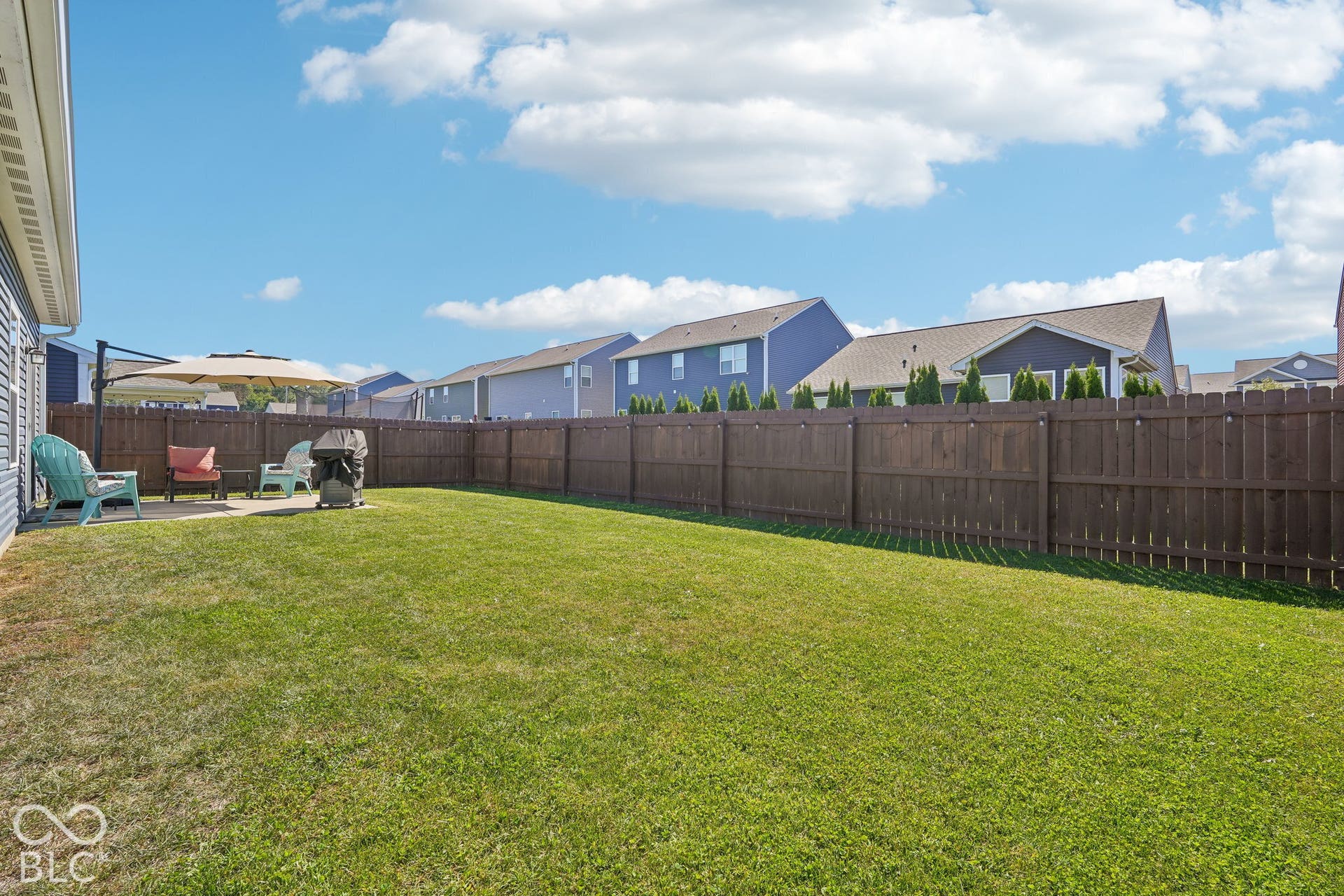 2945 W Calimanco Lane, Monrovia, IN 46157 Expansive grassy yard with a concrete patio and full privacy fencing