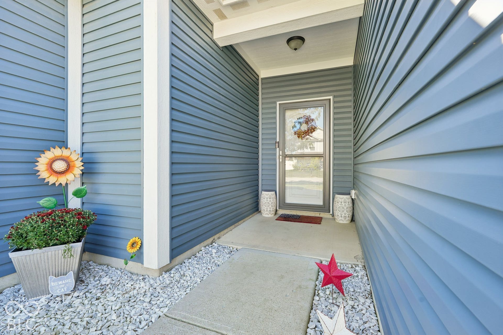 2945 W Calimanco Lane, Monrovia, IN 46157 Blue horizontal siding exterior with a concrete walkway and gravel landscaping