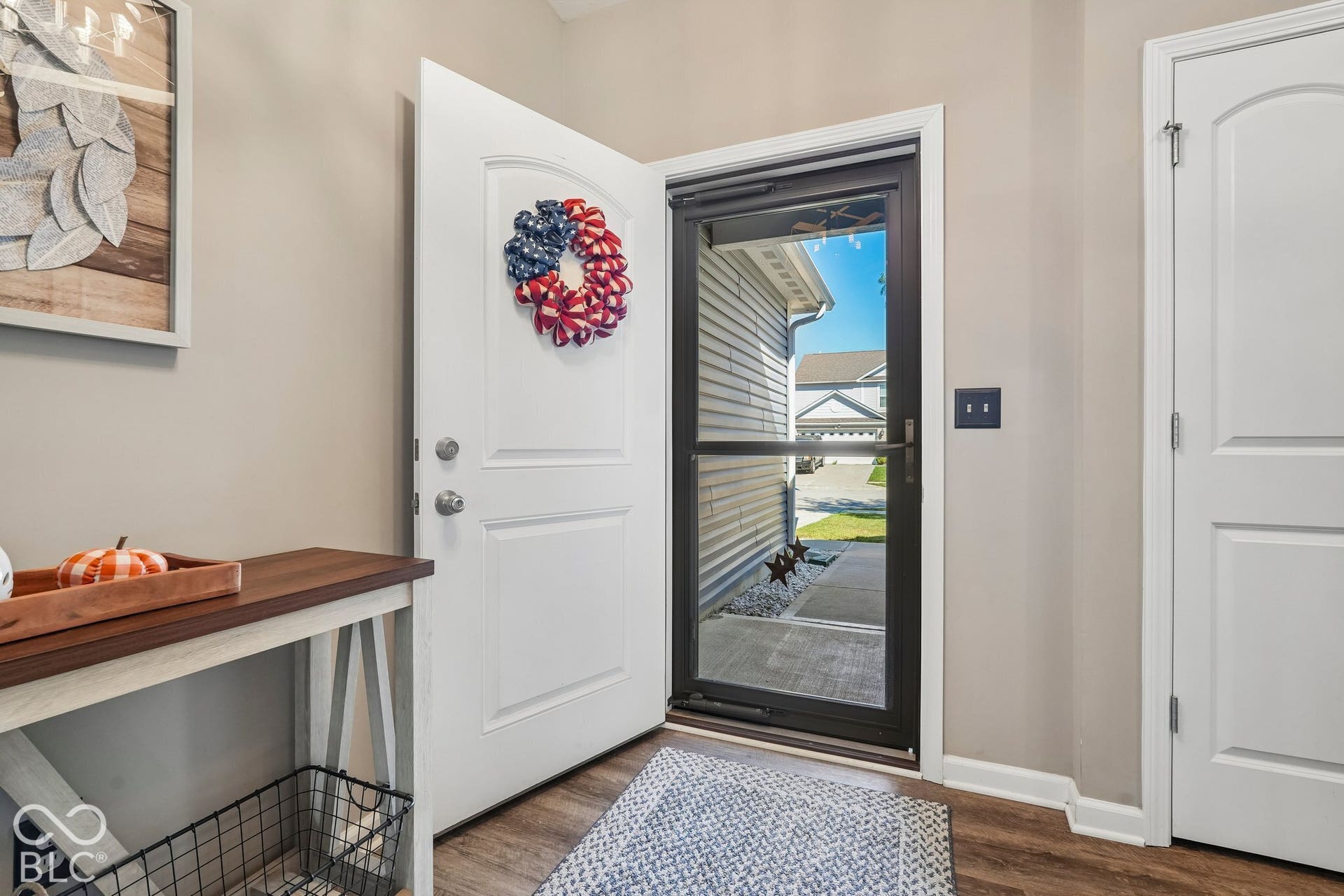 2945 W Calimanco Lane, Monrovia, IN 46157 Wood-finish flooring with light-toned wall paint and white trim