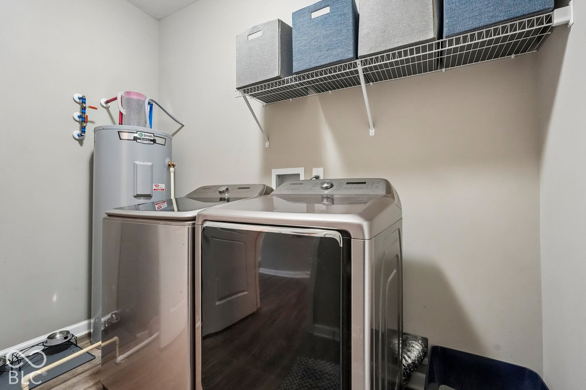 2945 W Calimanco Lane, Monrovia, IN 46157 Laundry area with a wire shelving unit, wood-finish flooring, and light-toned walls