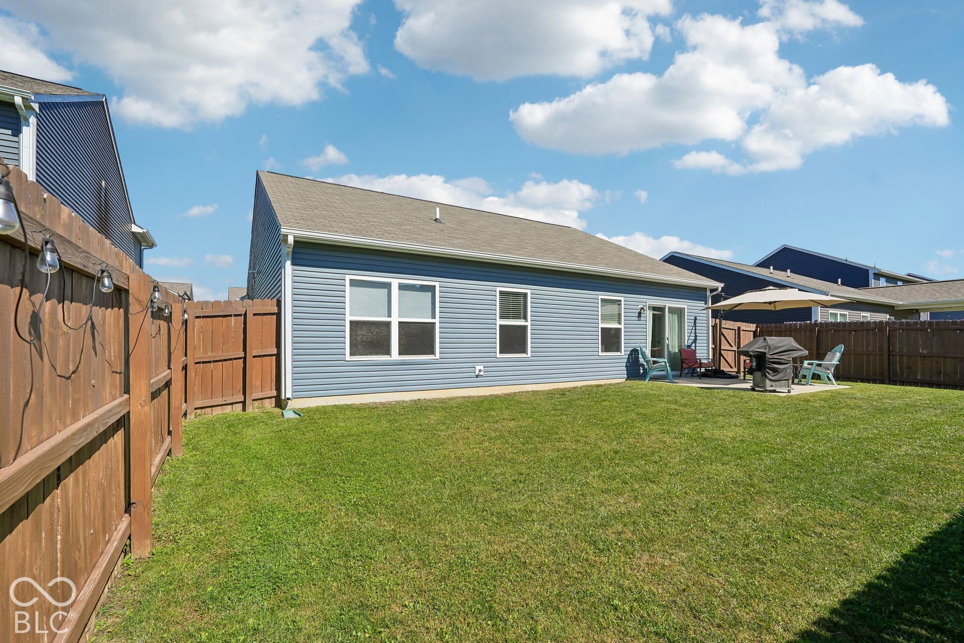 2945 W Calimanco Lane, Monrovia, IN 46157 Expansive backyard featuring a manicured lawn, full privacy fencing, and a concrete patio