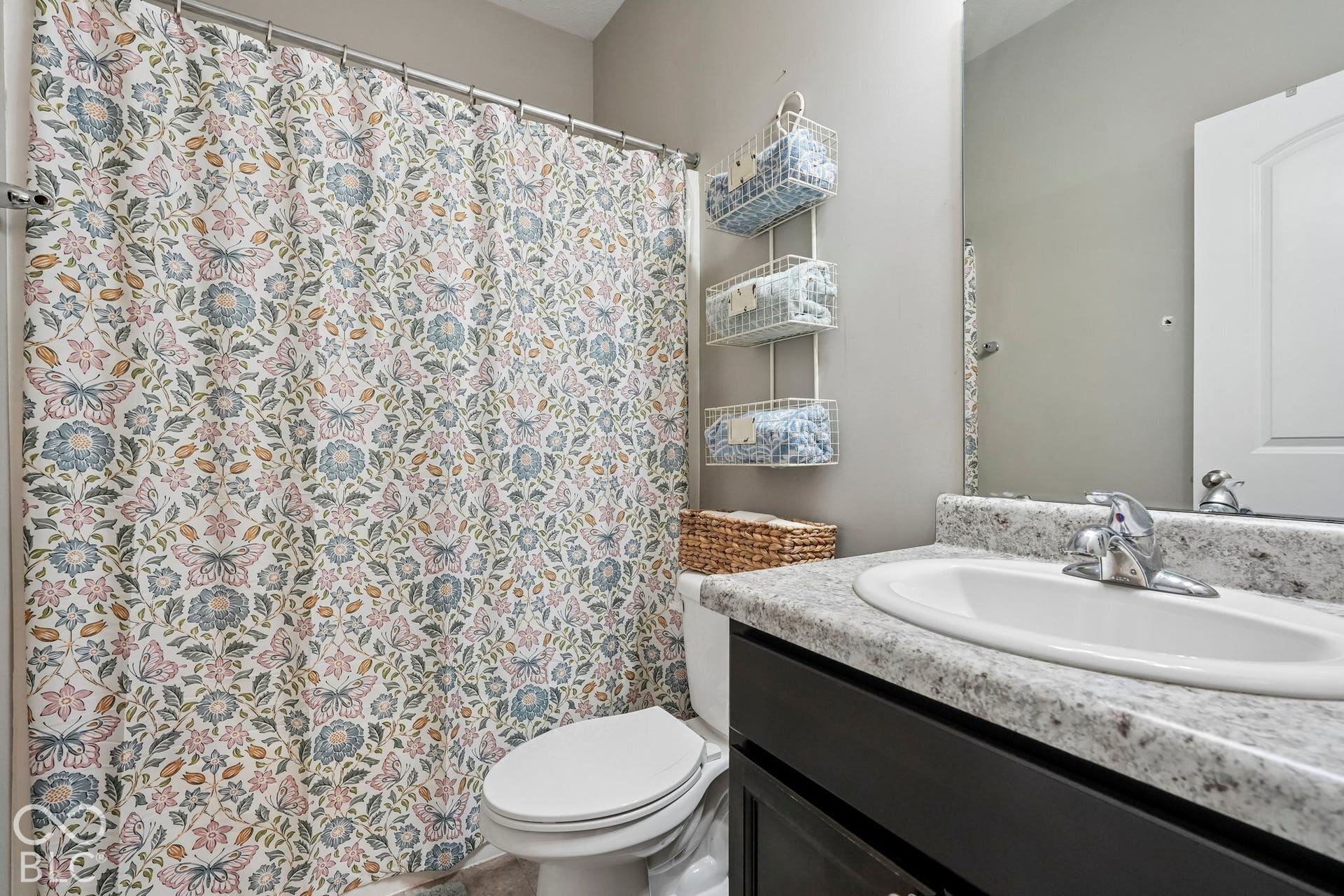 2945 W Calimanco Lane, Monrovia, IN 46157 Bathroom featuring a single vanity with an integrated sink, polished chrome faucet, and speckled countertop