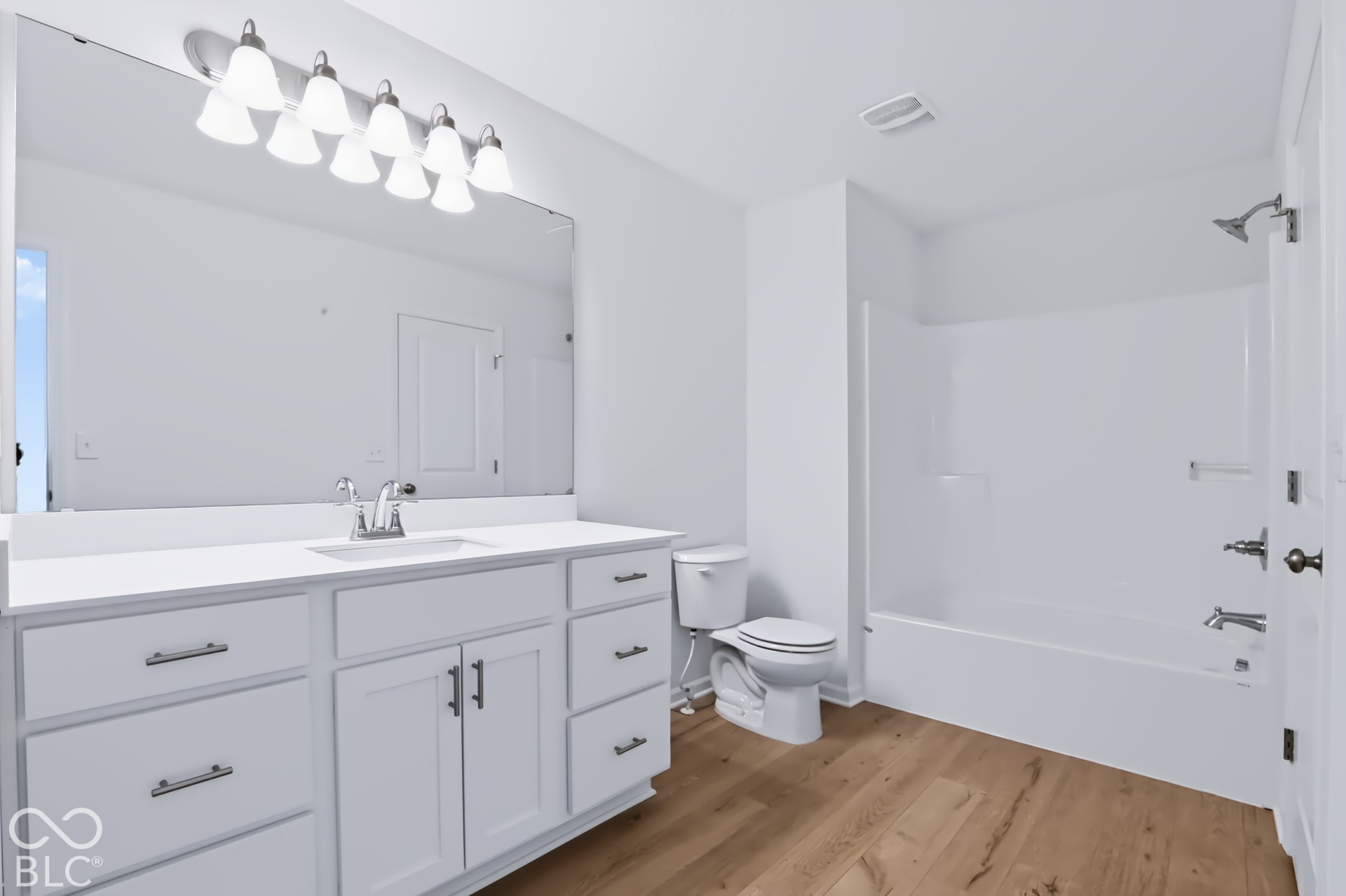 Spacious vanity with a white countertop and undermount sink