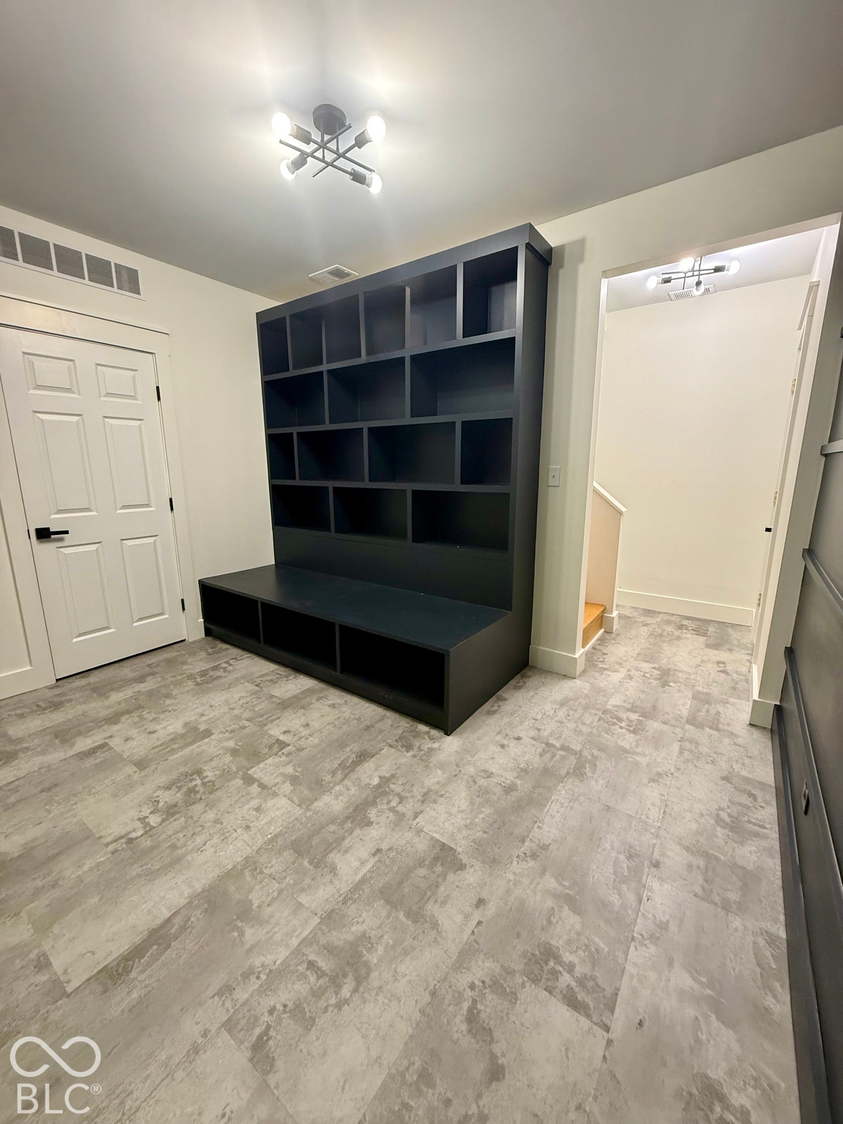 Built-in shelving unit with integrated bench seating.