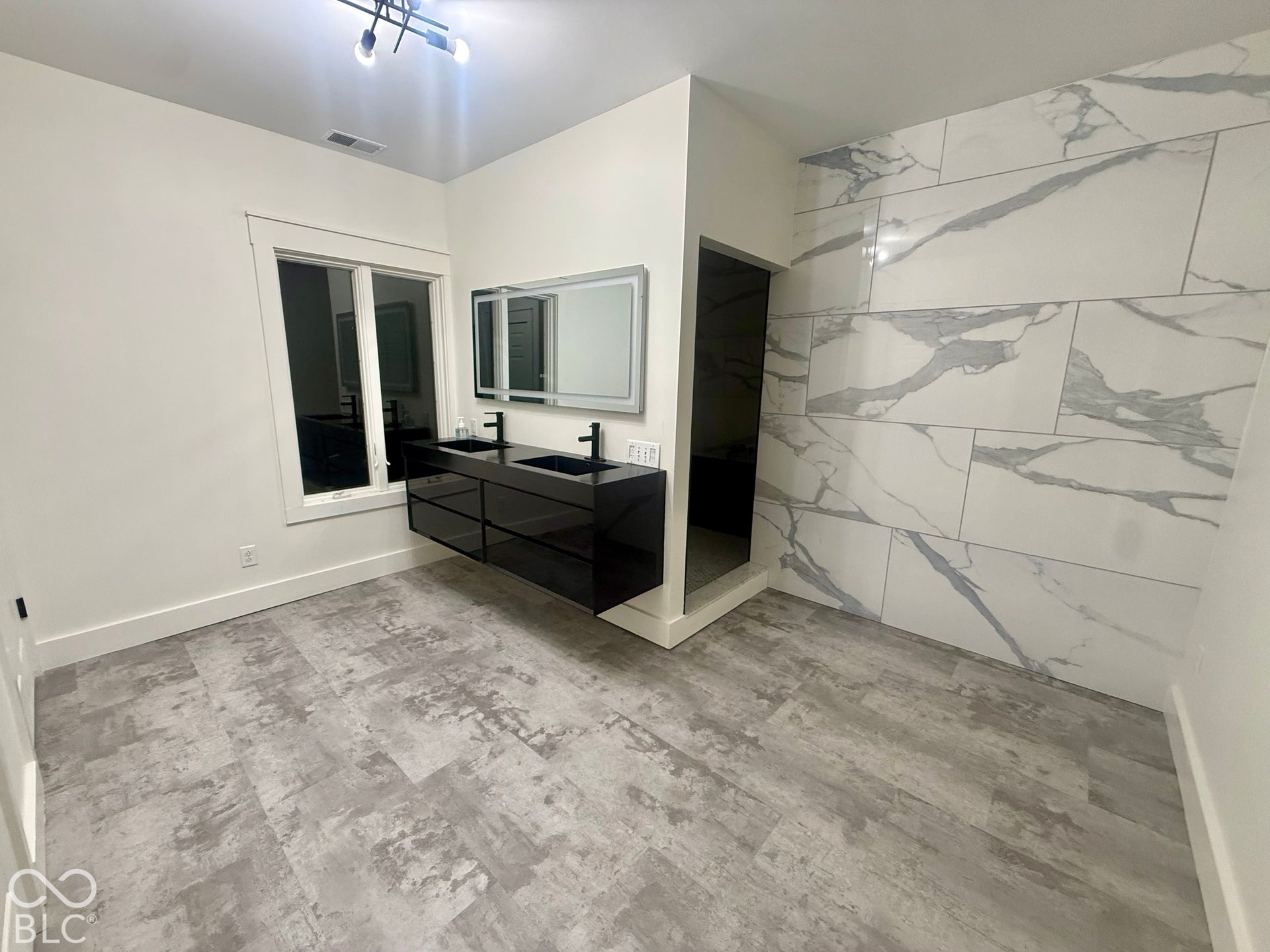 Expansive master bathroom off of master bedroom in basement.