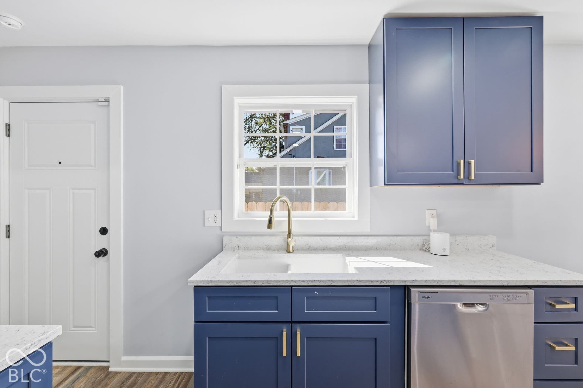 White paneled door with black hardware