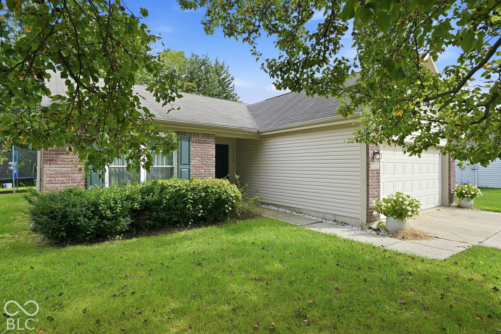 Brick and siding exterior with a two-car garage