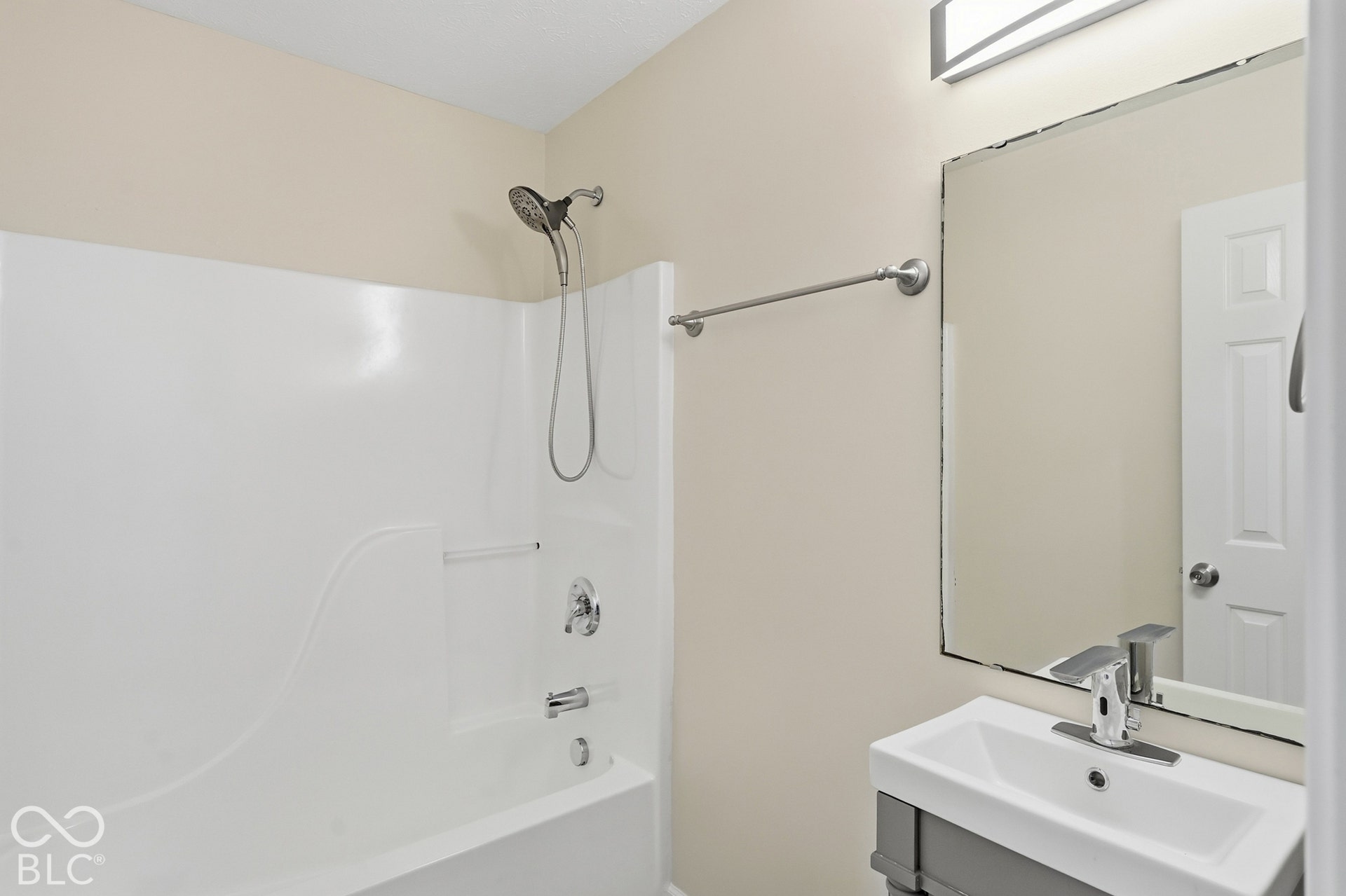 Tub-shower combination with a chrome shower head and faucet