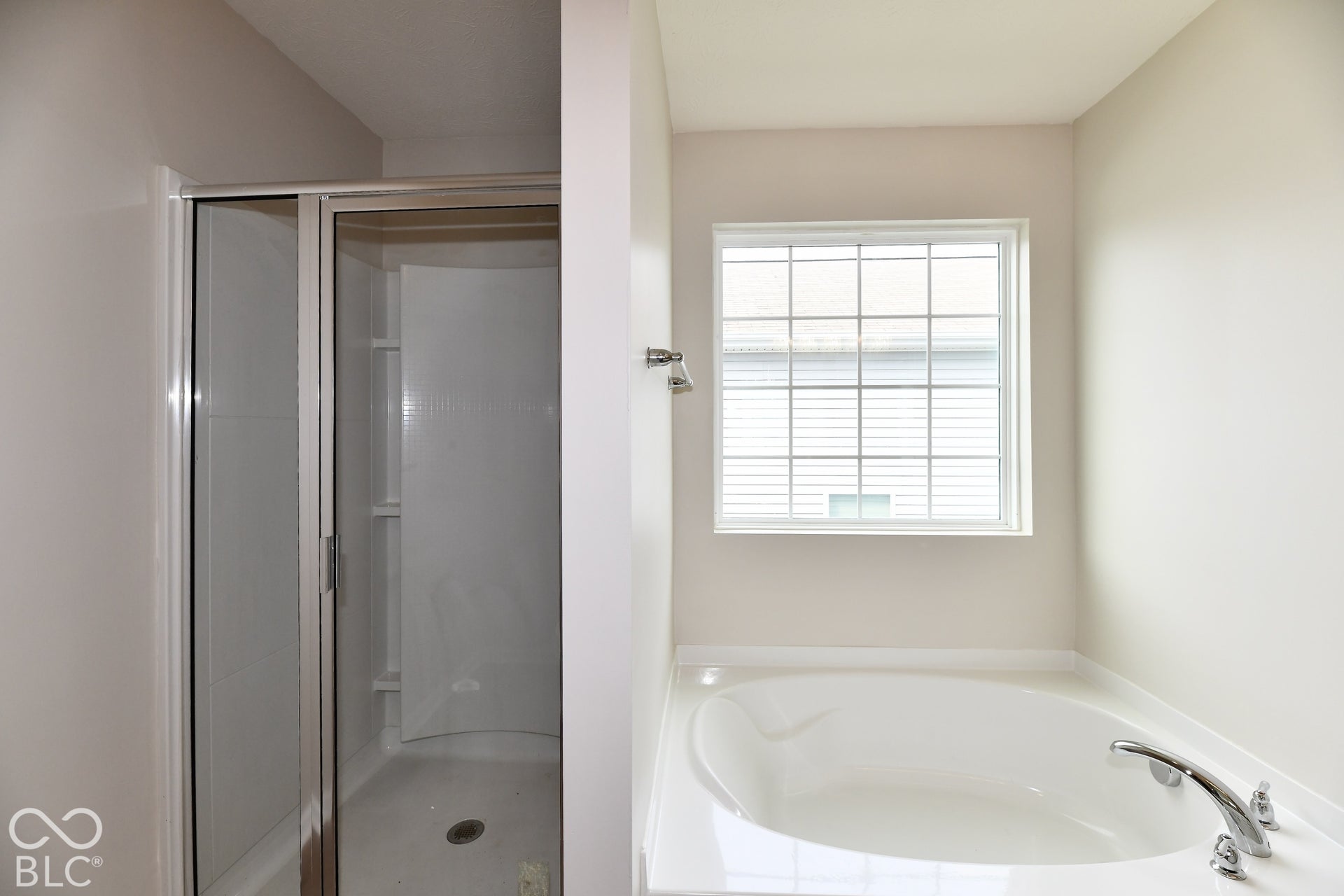 Walk-in shower with clear glass enclosure