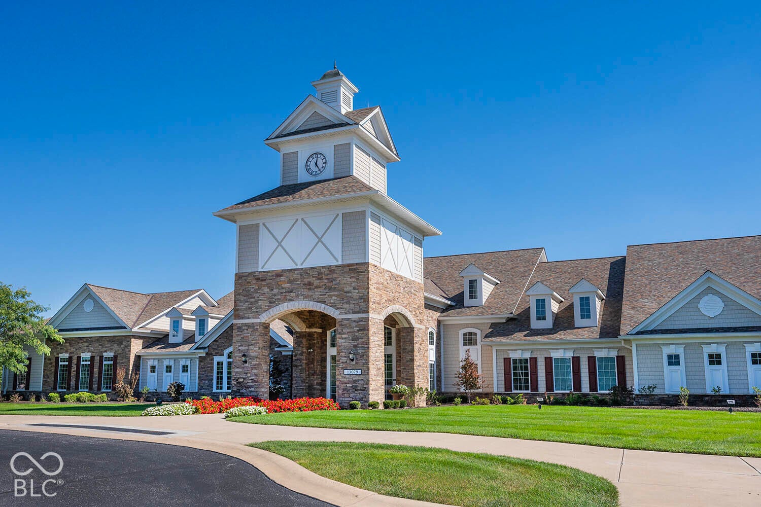 This is the Chateau, which serves as the main community center for this 55+ community. The Amenities include indoor and outdoor pools, strength training equipment, tennis/pickleball courts, bocce ball courts, arts & craft area, trails, etc.