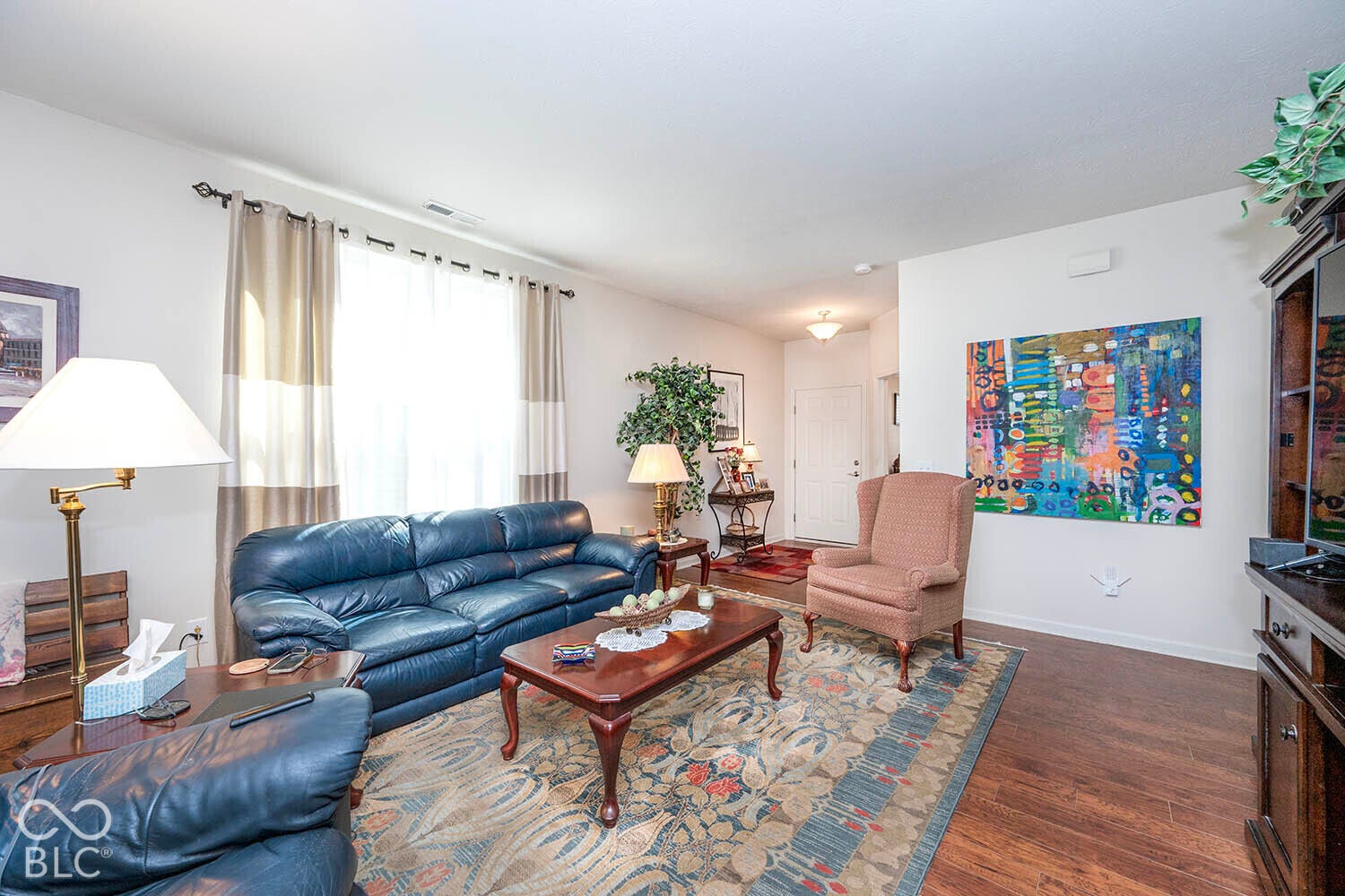 View of the Great Room showing laminate flooring and looking towards front foyer and the Den