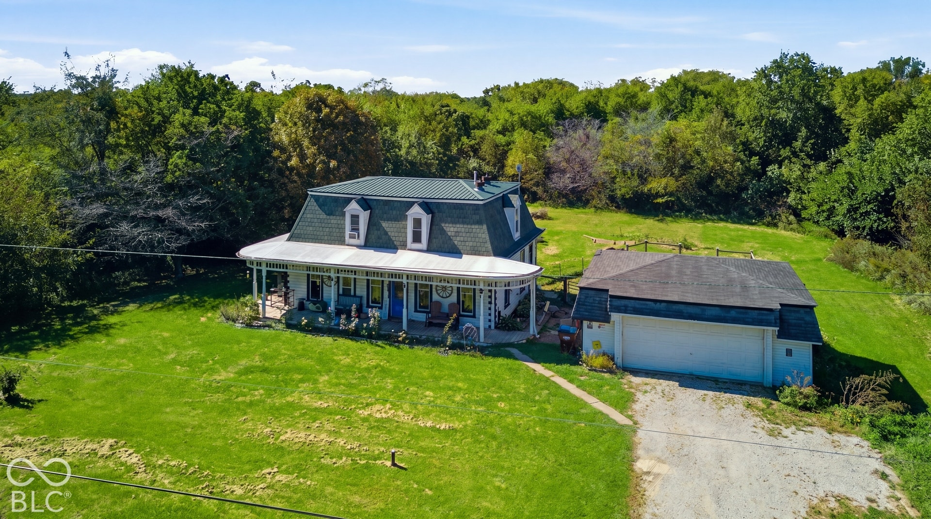 Virtually Altered - Dormer windows, a full wrap-around porch, and a detached two-car garage
