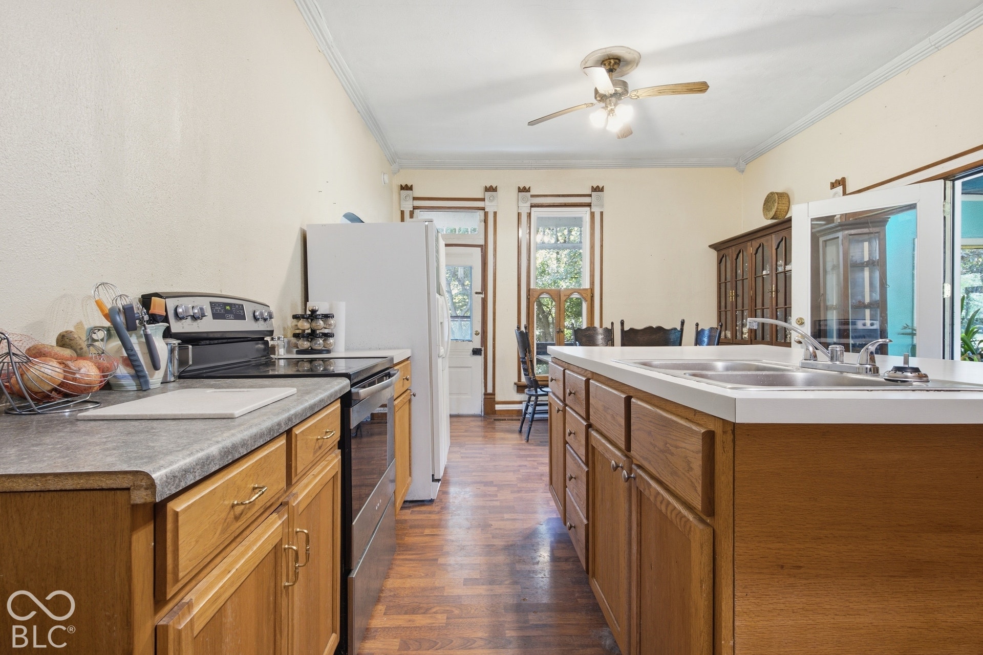 Wood-finish flooring with light-toned cabinetry and light-colored countertops