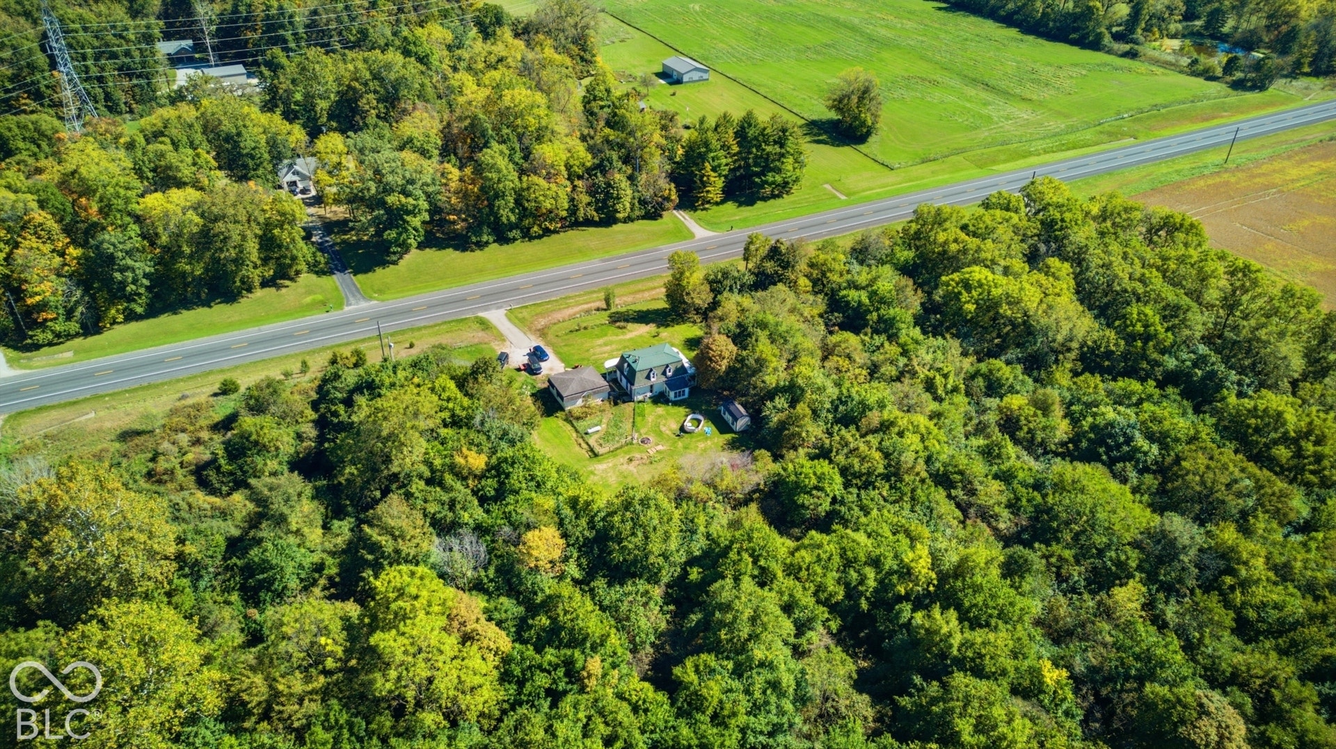 Extensive natural tree coverage and a paved road