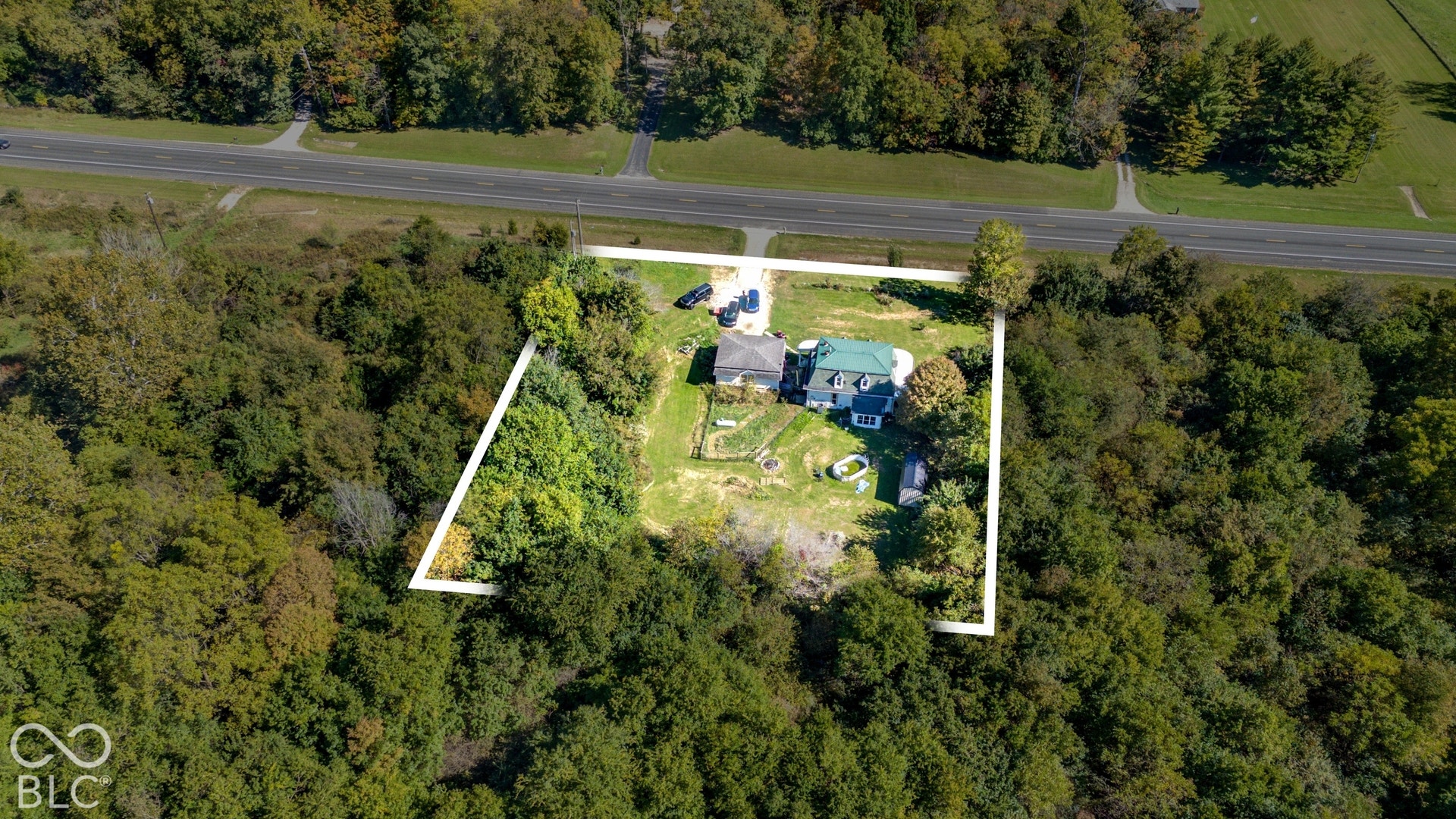 Expansive wooded lot with direct road access