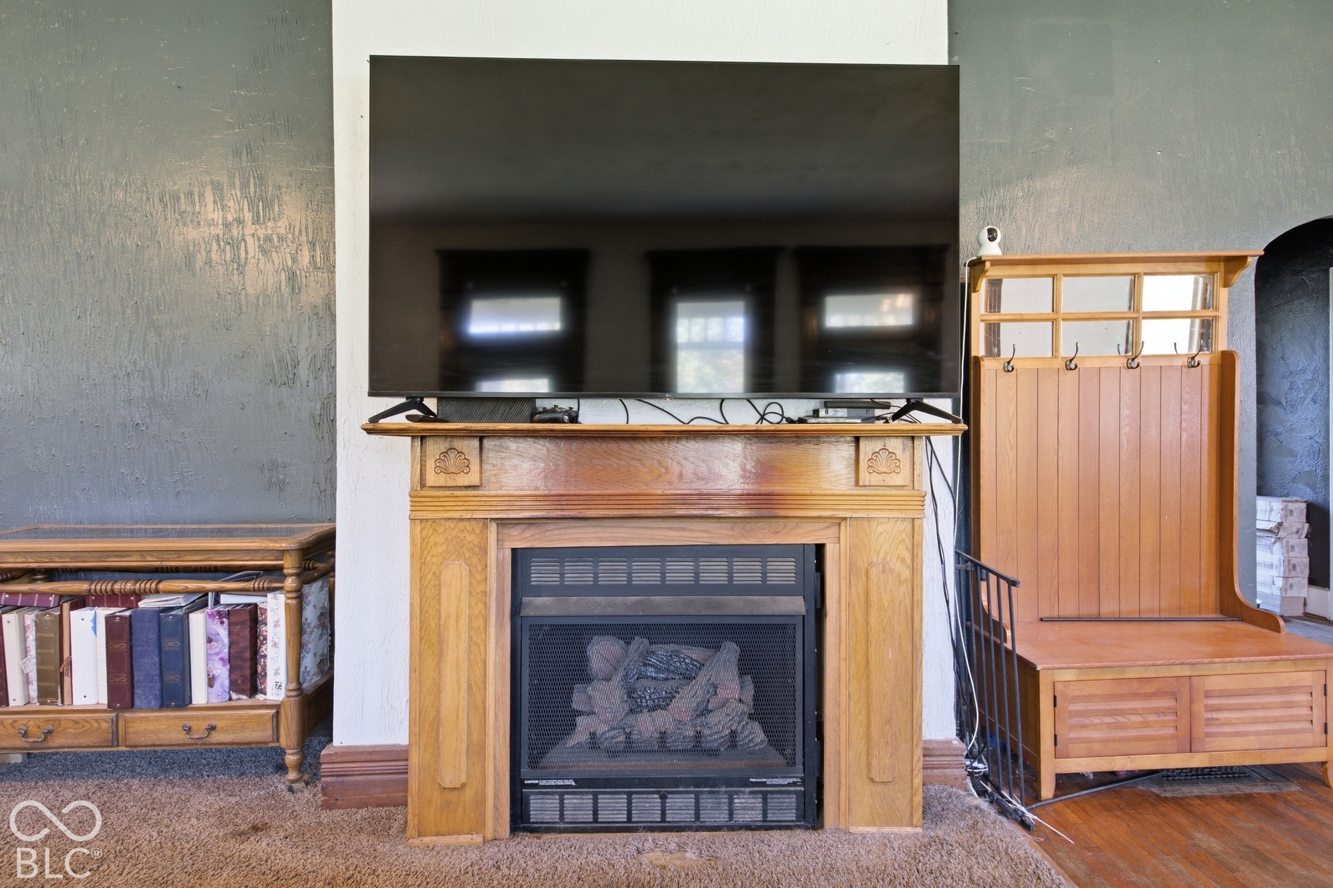 Built-in fireplace with a wood mantel