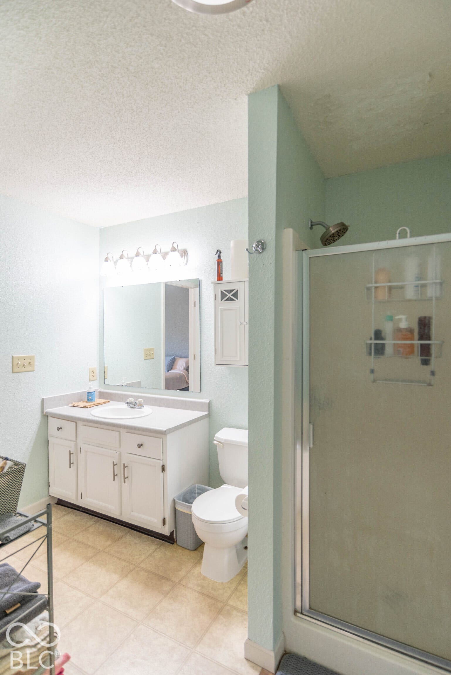 Primary ensuite bath with garden tub and separate shower with sliding glass door