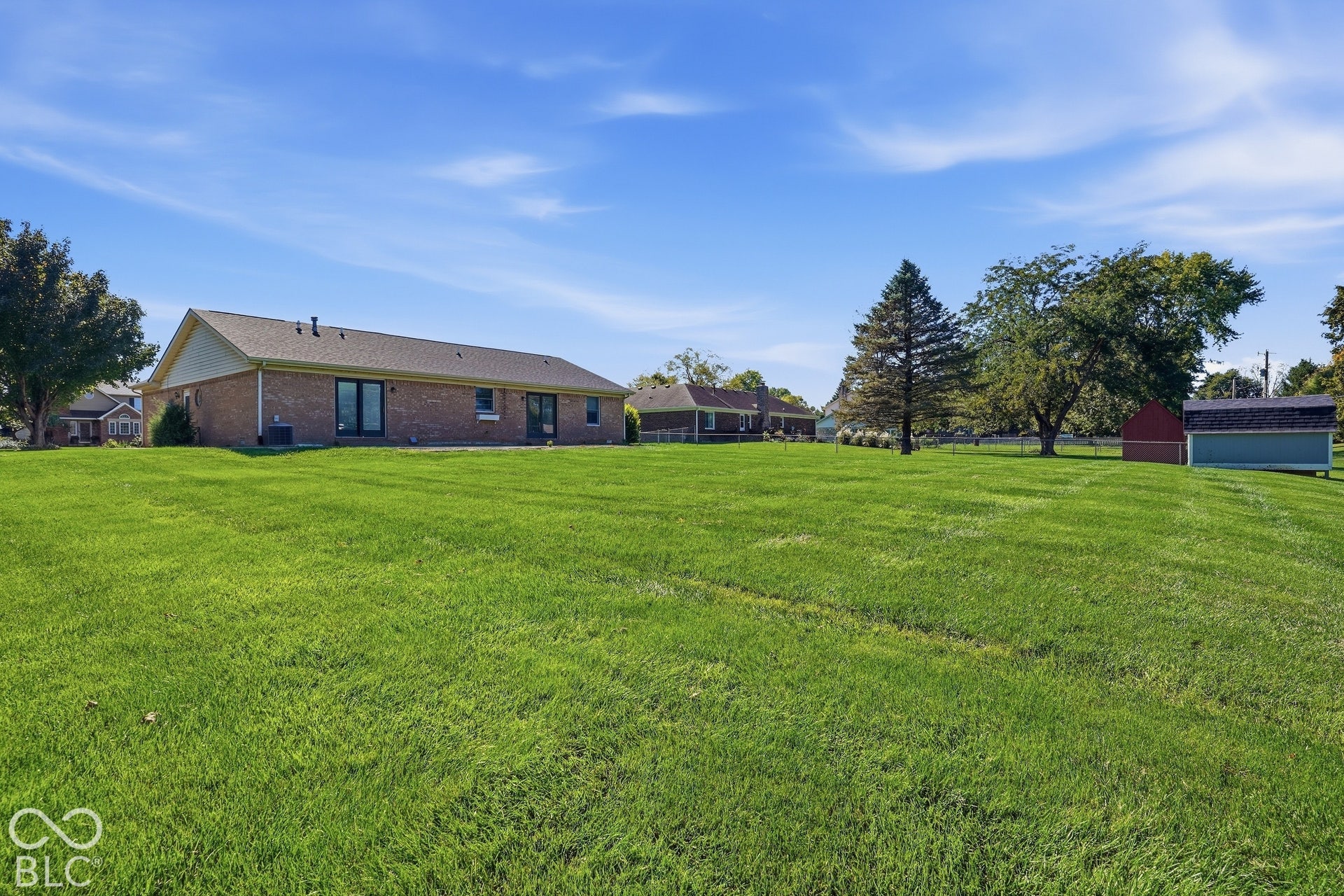Expansive lawn area with mature trees