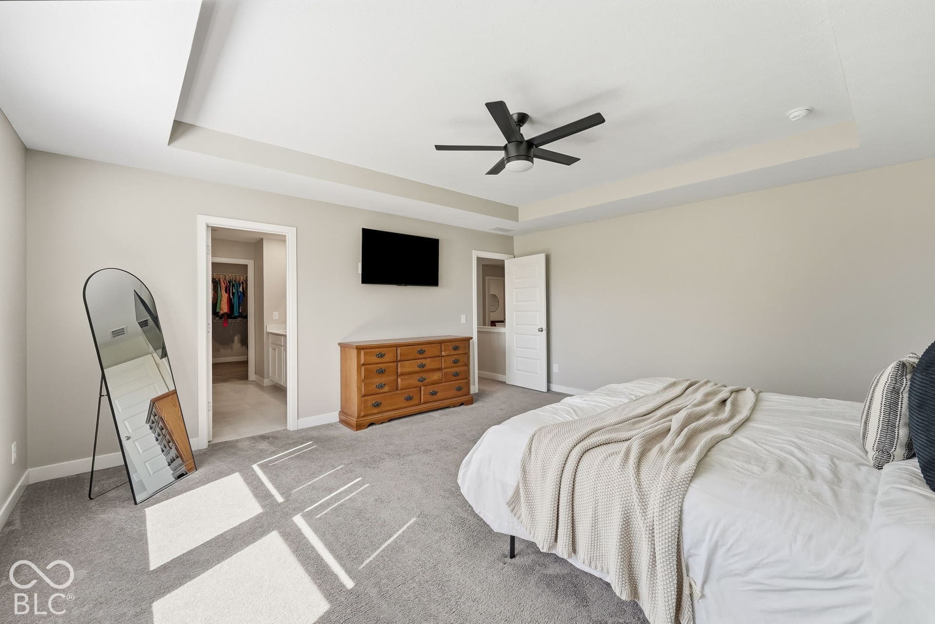 Large Primary Bedroom with tray ceiling.