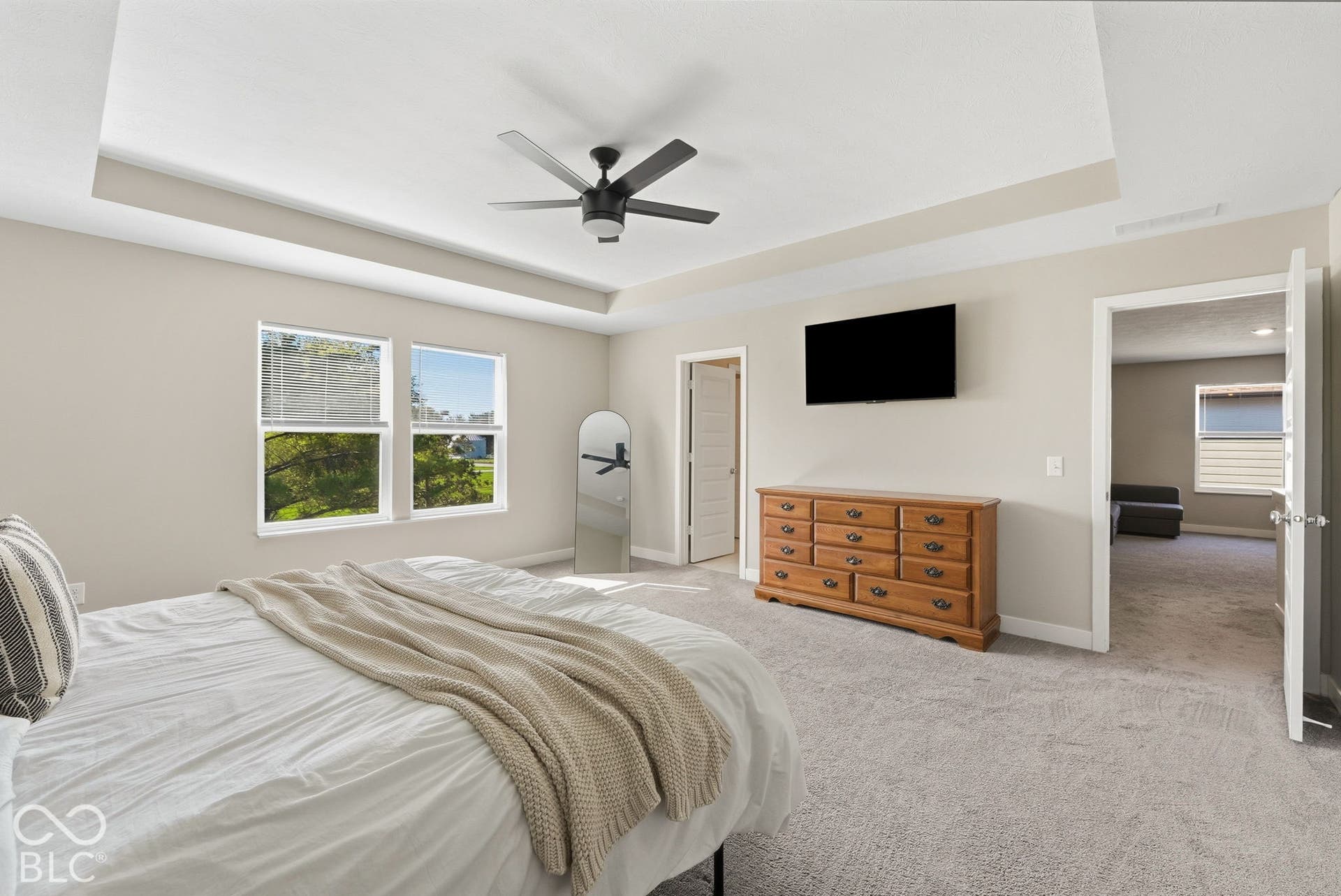 Large Primary Bedroom with tray ceiling.