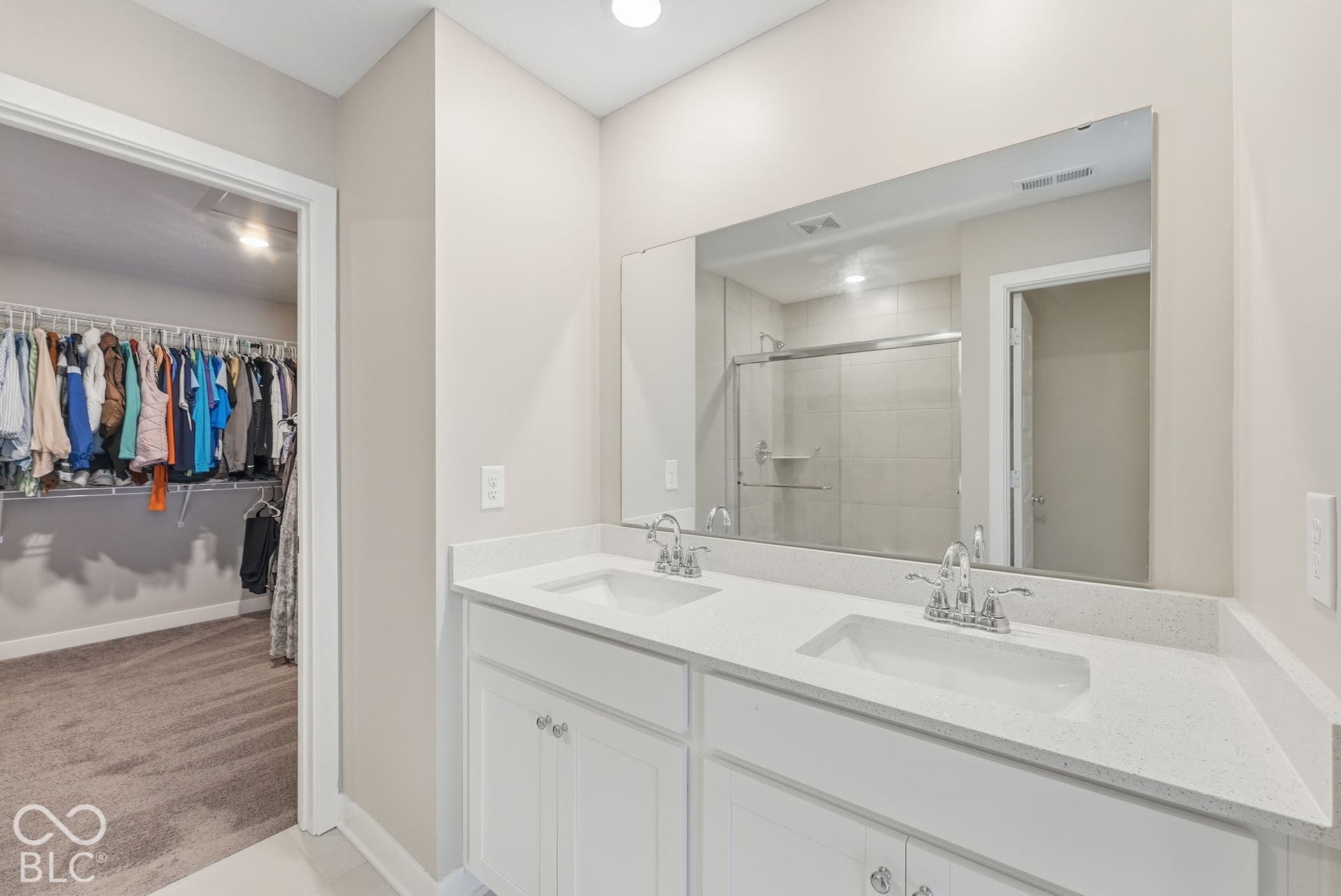 Primary bedroom/bathroom features a double sink vanity and huge walk-in closet!