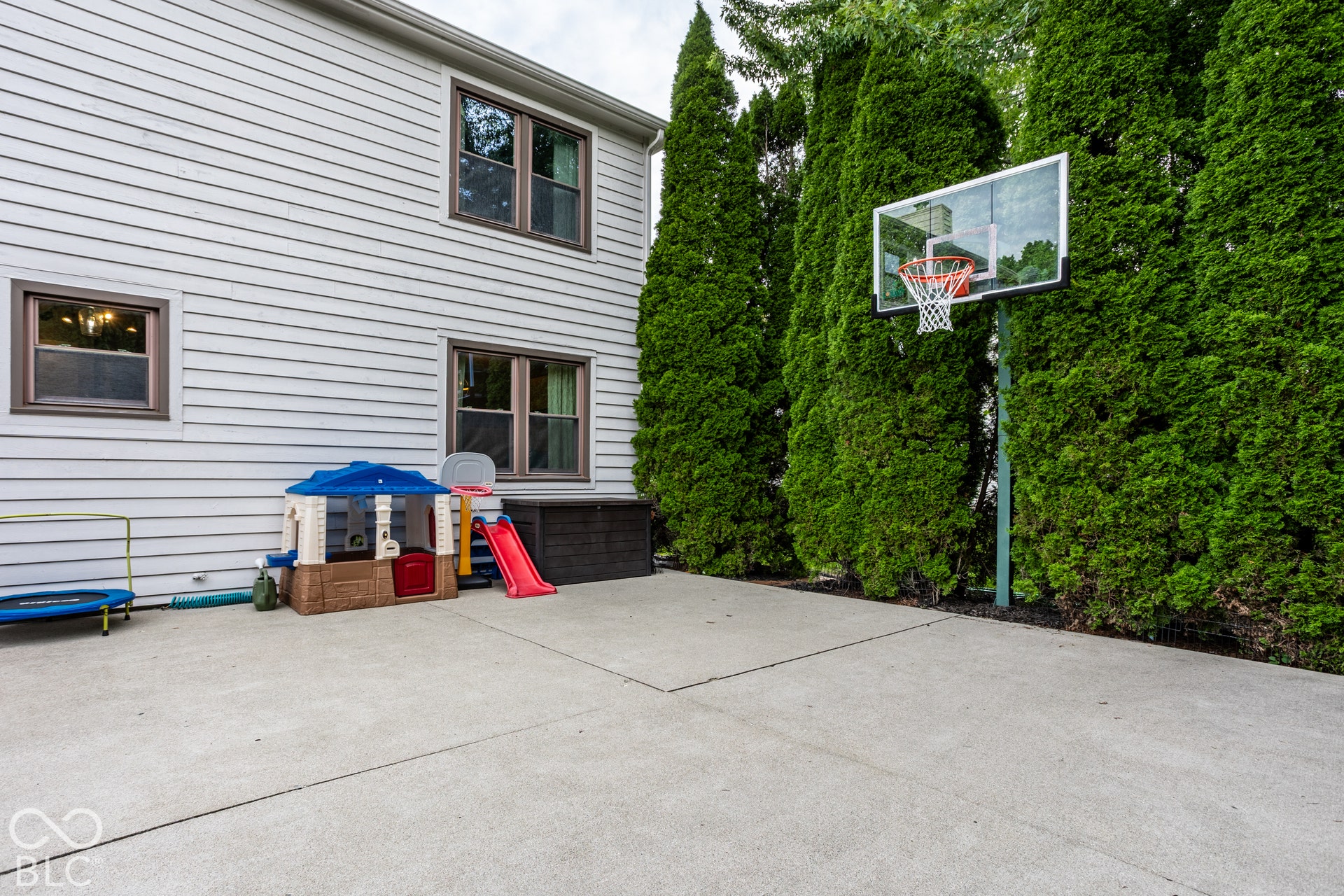 Large Patio for bikes, big wheels, Chalk Drawing and Hoops!