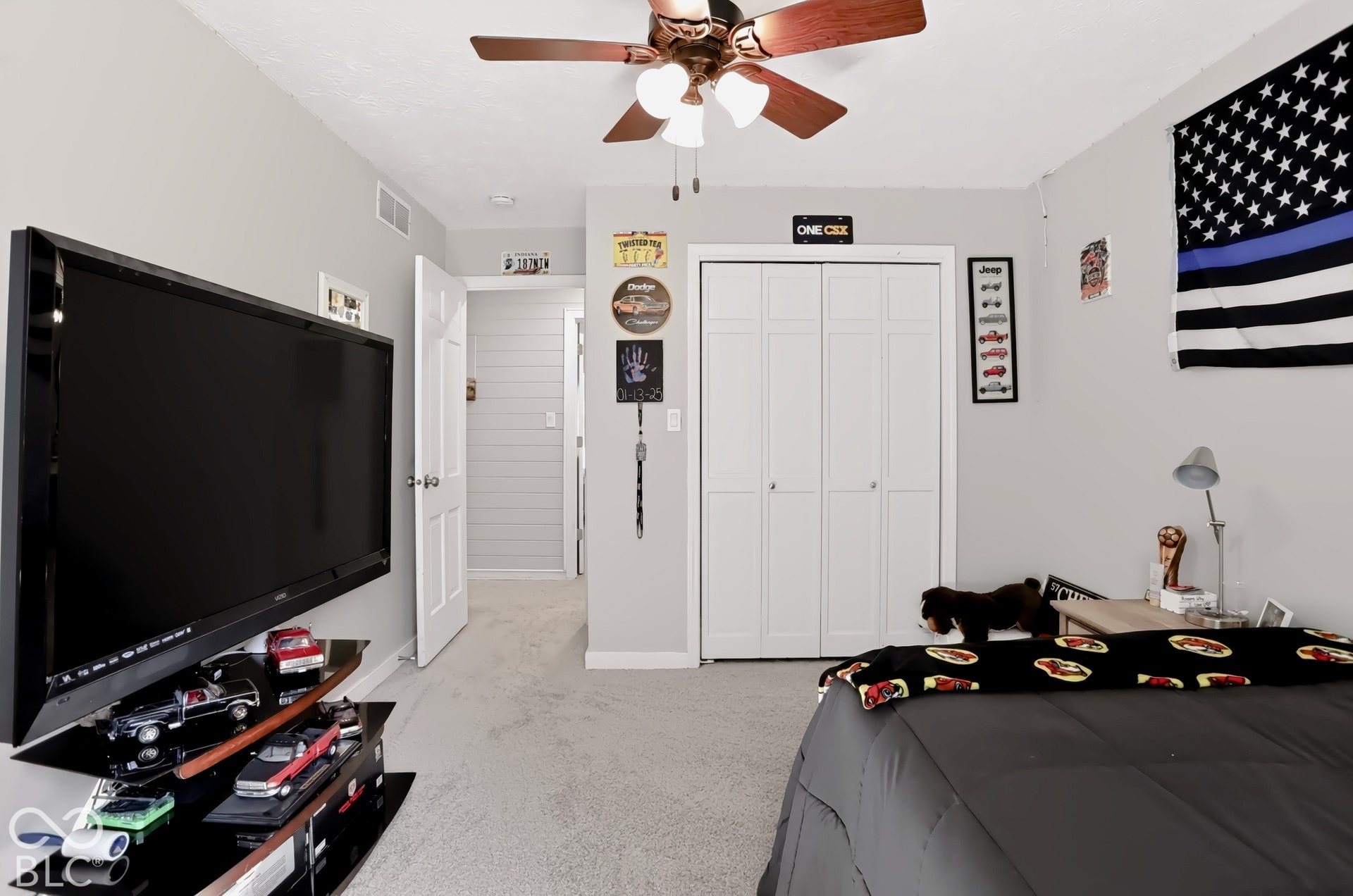 Recessed lighting, wood-finish ceiling fan, neutral wall color, carpeted flooring, and a bi-fold closet door
