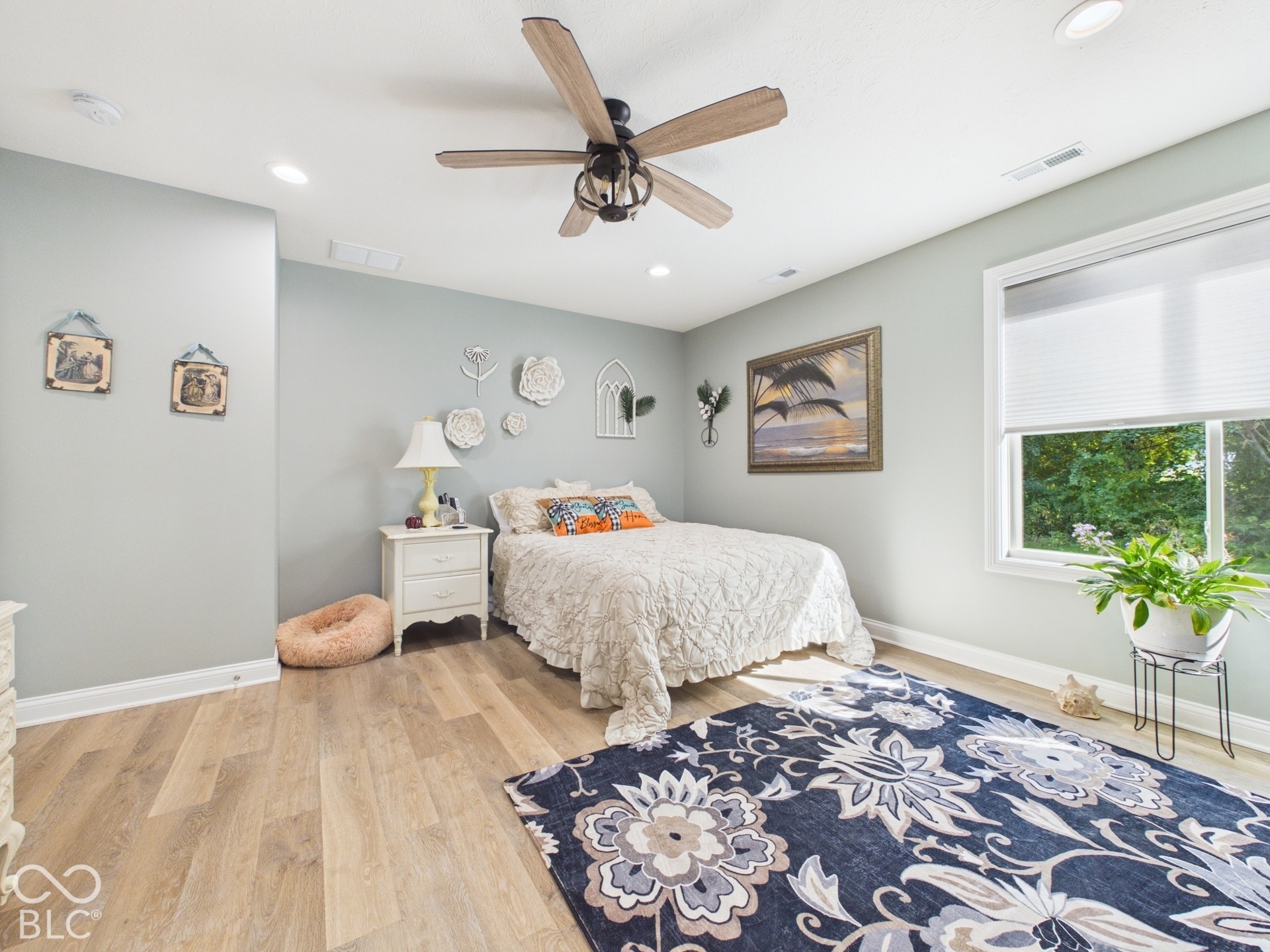 Wood-finish flooring, recessed lighting, ceiling fan, white trim, and a window with blinds