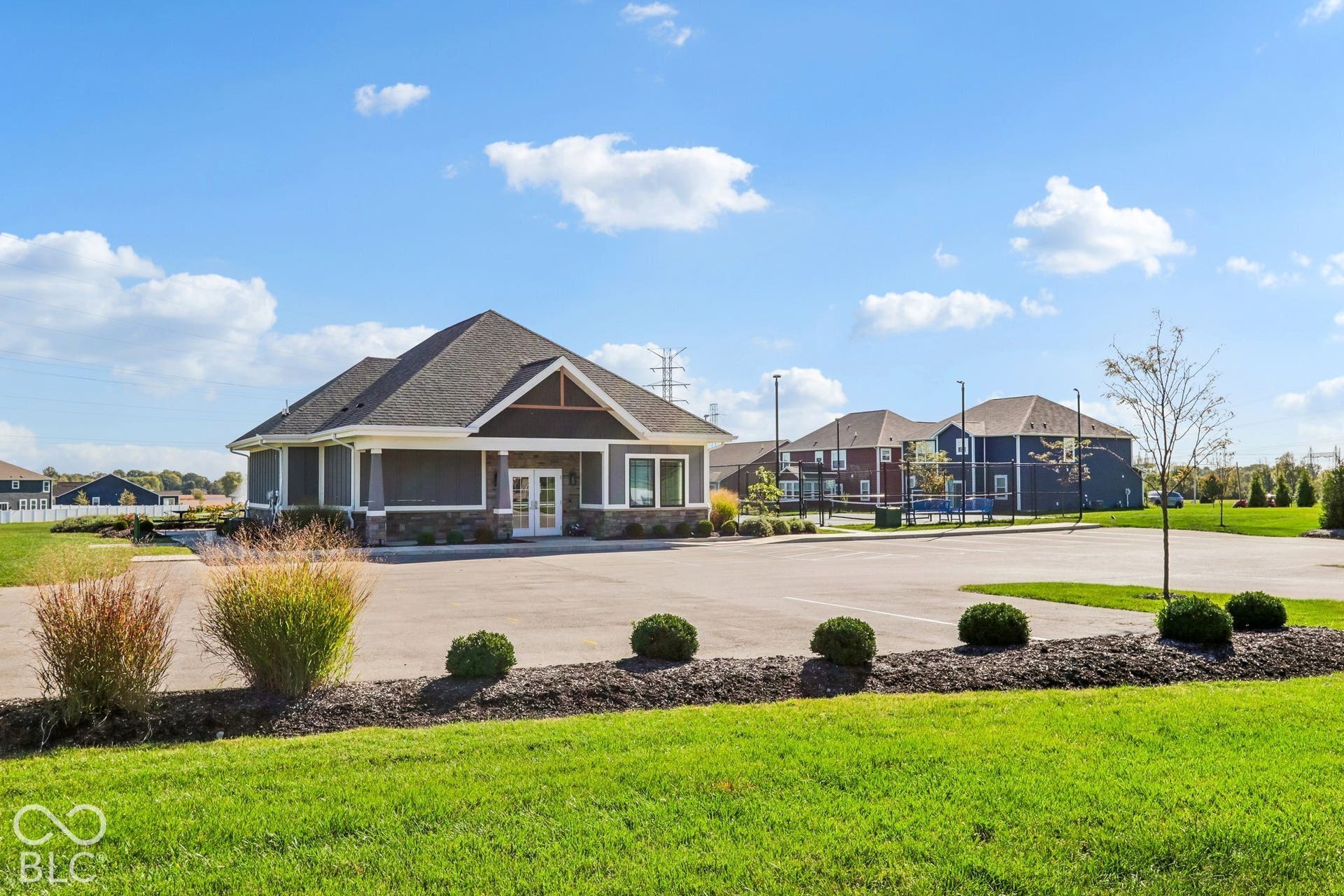 Edgewood Farms Community Clubhouse with paved parking area