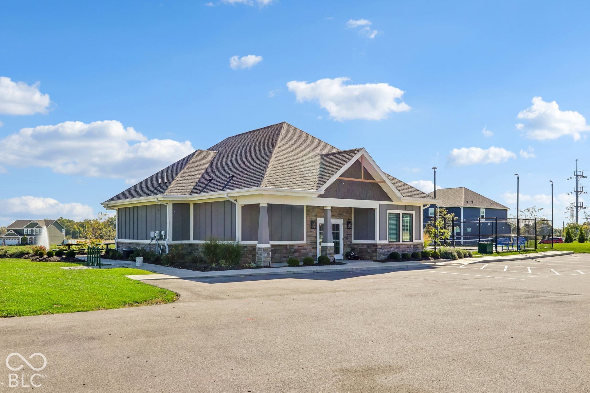 Edgewood Farms Community Clubhouse with paved parking area