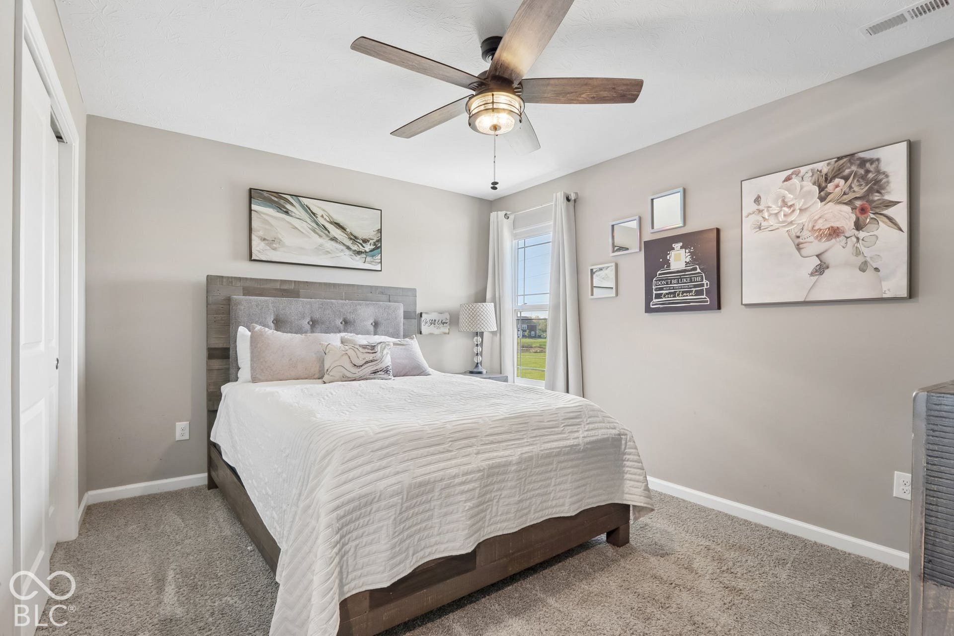Bedroom 3 of 4 - updated ceiling fan and custom black-out blinds