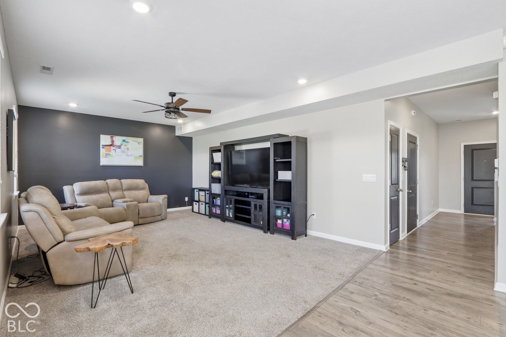 Recessed lighting, ceiling fan, and a neutral color palette
