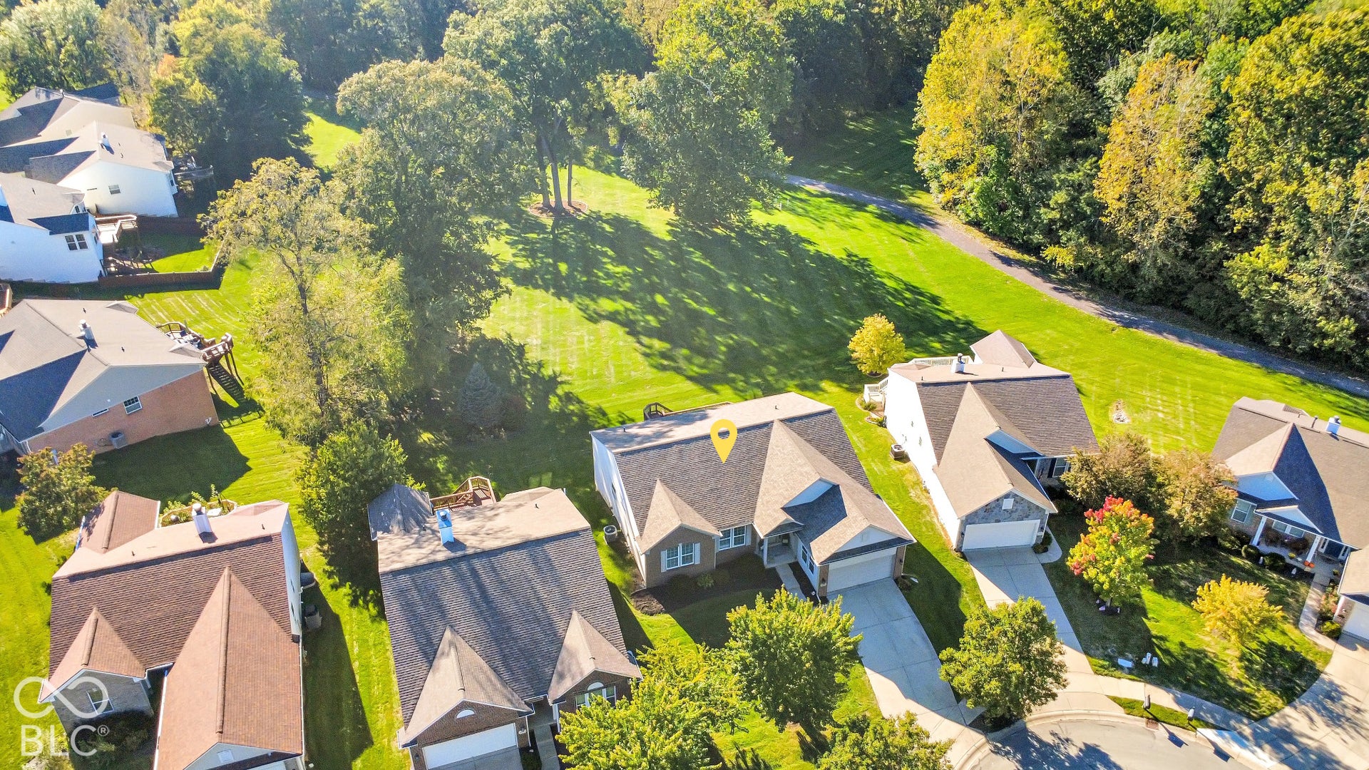 The expansive common area and Geist Greenway run along the back of the home.