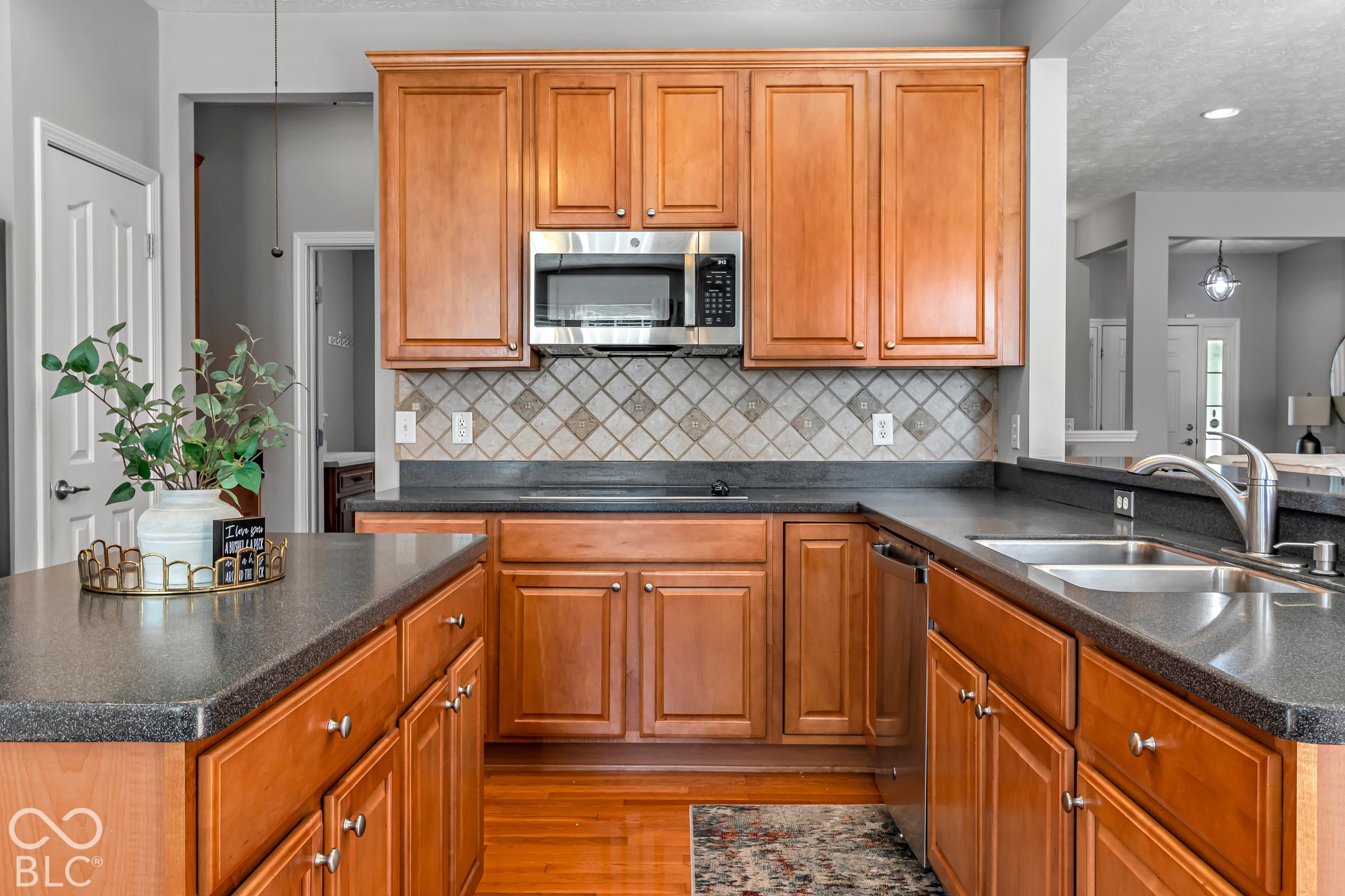 The decorative tile backsplash and granite countertops elevate the space!
