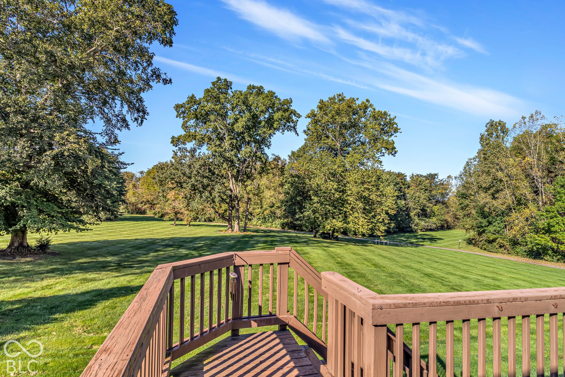 The large common space and tree lined walking trail make this backyard a true showstopper!