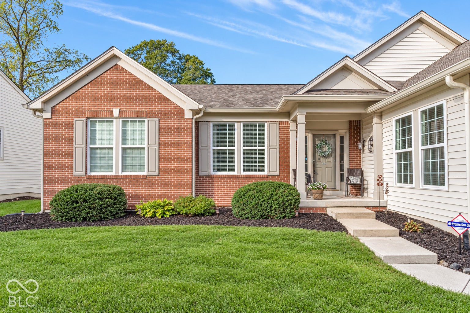 Fresh mulch and low maintenance landscaping provide great curb appeal.
