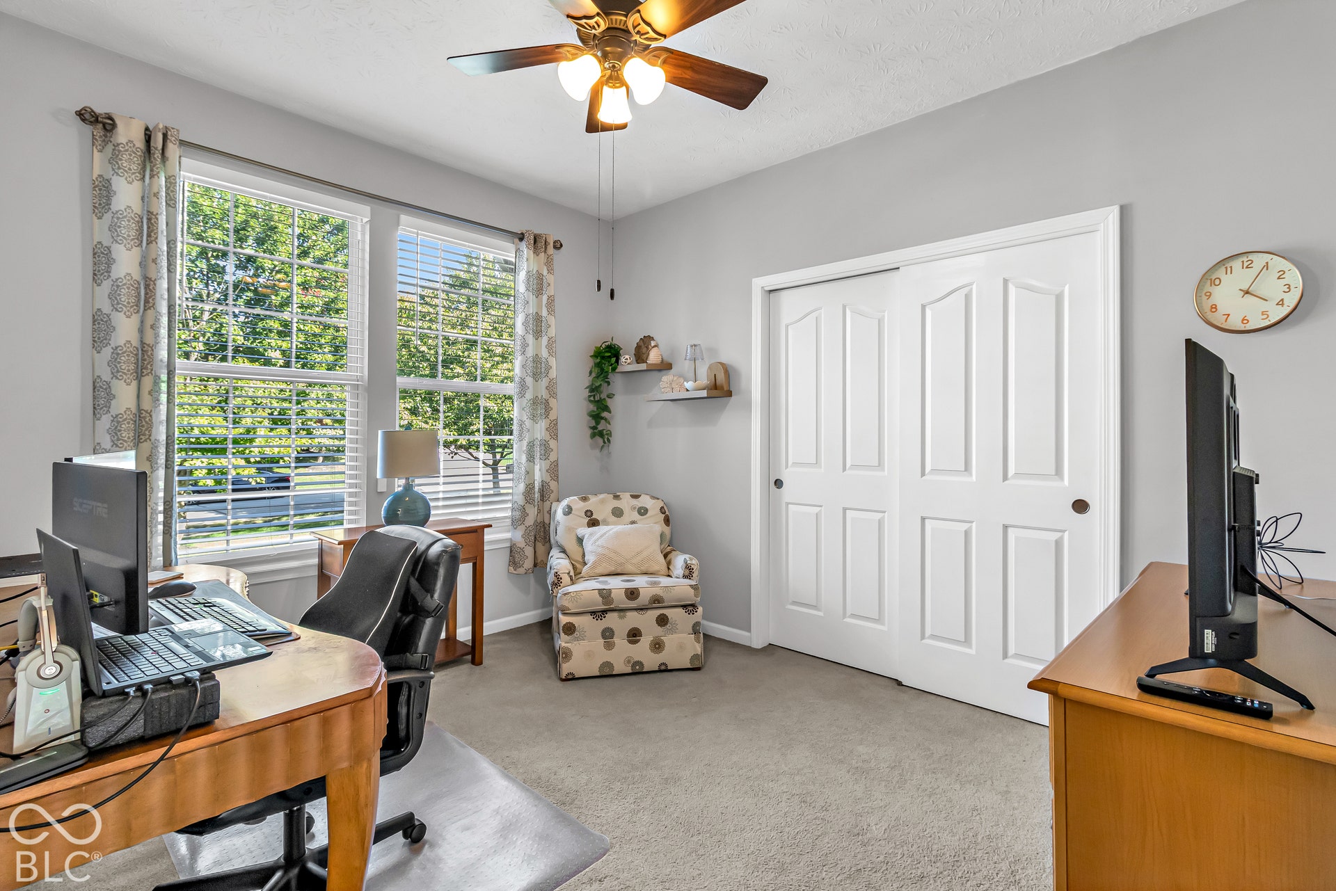 Bedroom #3 is located just off the main entrance and is currently utilized as an office with french doors.