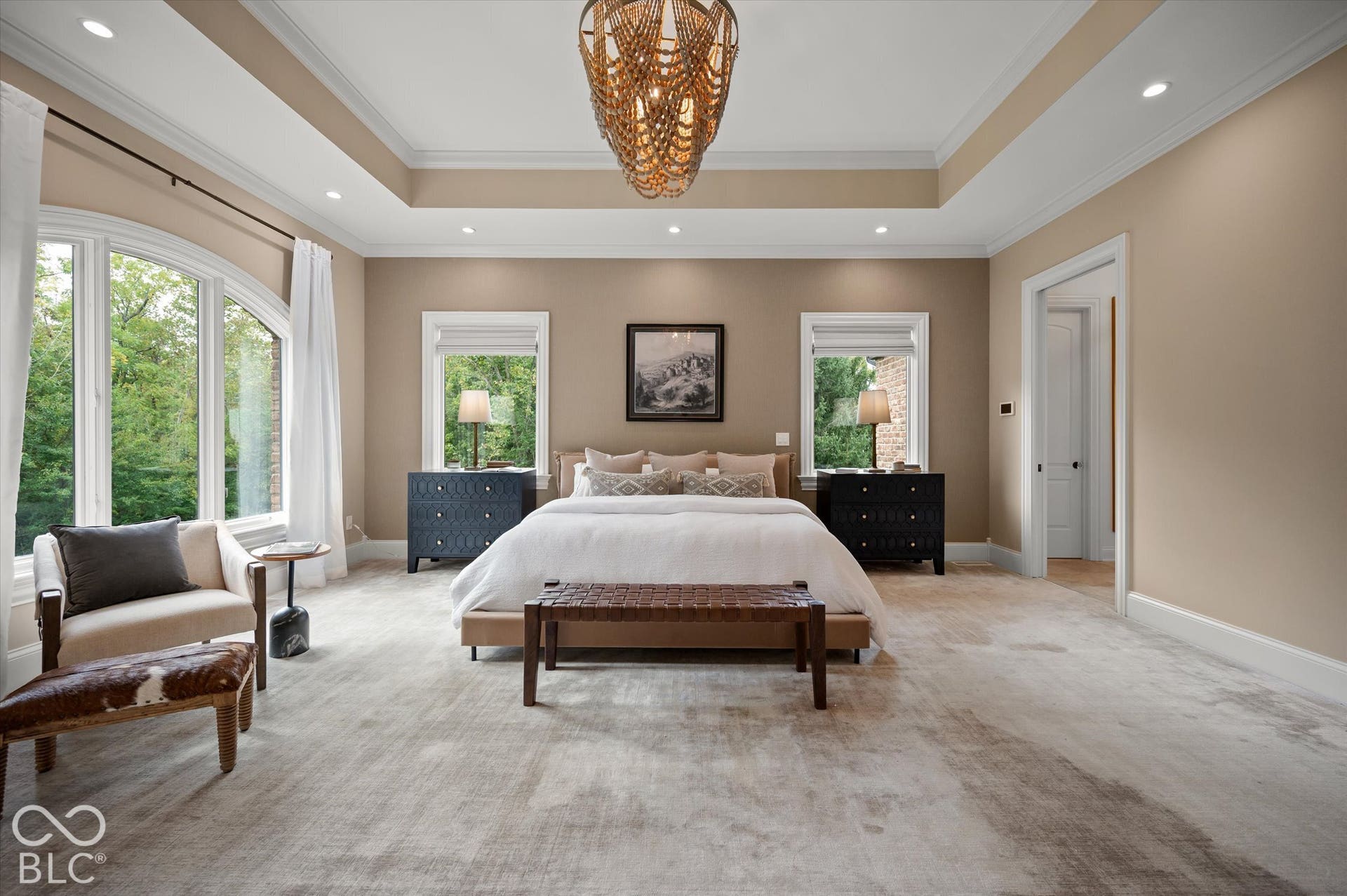 Tray ceiling with recessed lighting and crown molding